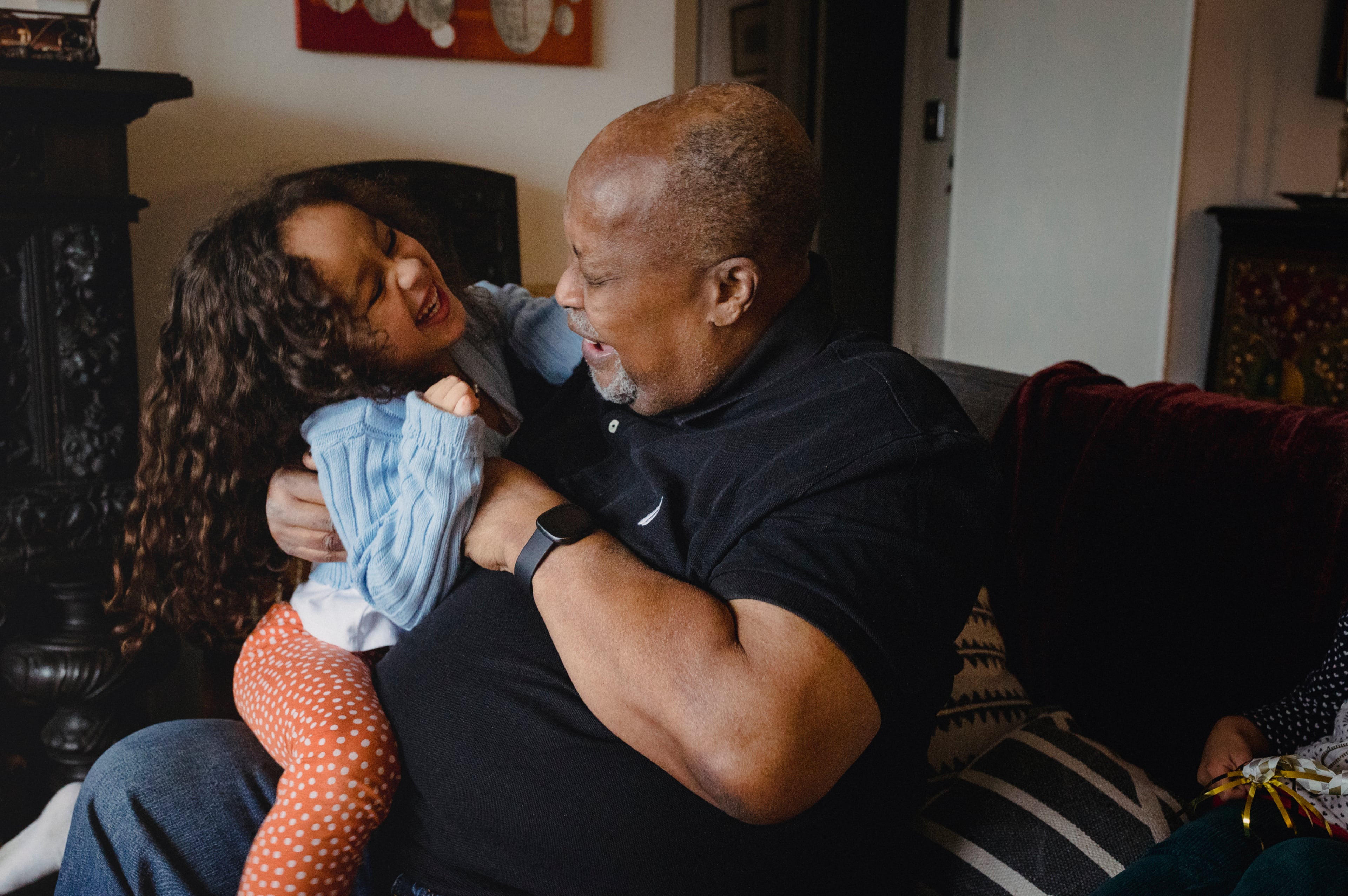 Barry Sage-El, 69, who describes himself as Òthe master of the sleepover,Ó with one of his granddaughters at his home in Montclair, N.J., Feb. 27, 2023. (Sara Naomi Lewkowicz/The New York Times)
