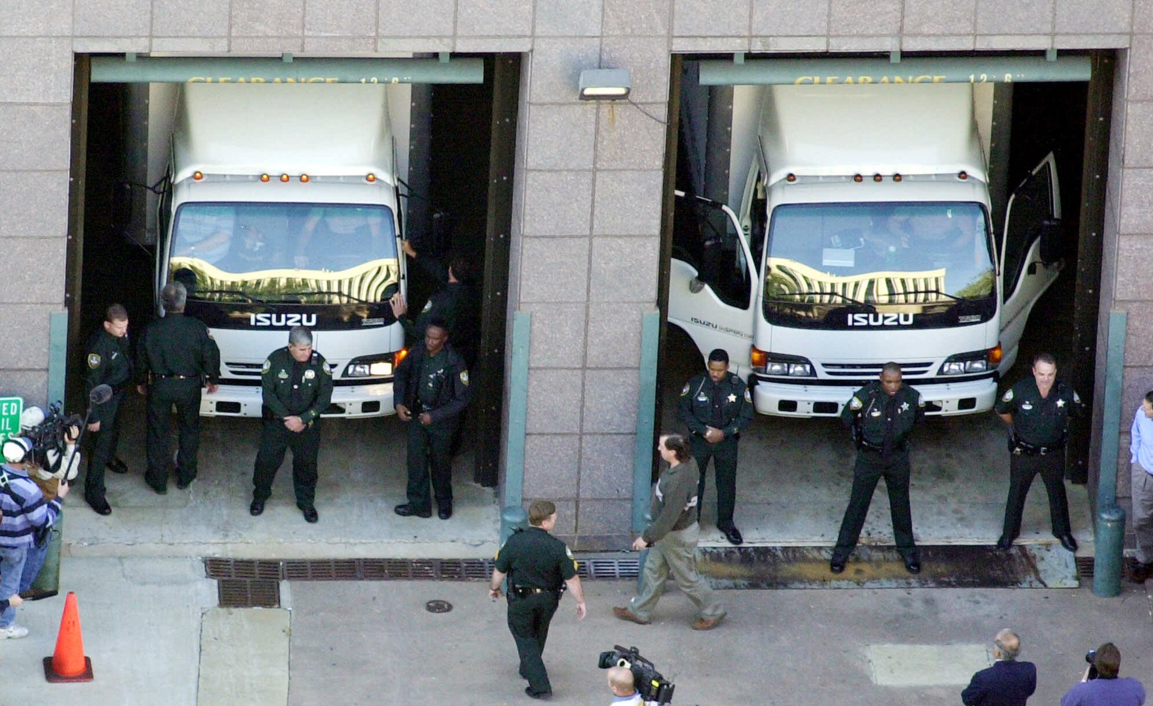 Trucks carrying 654,000 ballots from Miami-Dade County arrive at the Leon County Courthouse in Tallahassee, Fla., Friday, Dec. 1, 2000. The ballots were transported to Tallahassee after a court order by Leon County Circuit Judge N. Sanders Sauls. (AP Photo/Dave Martin)