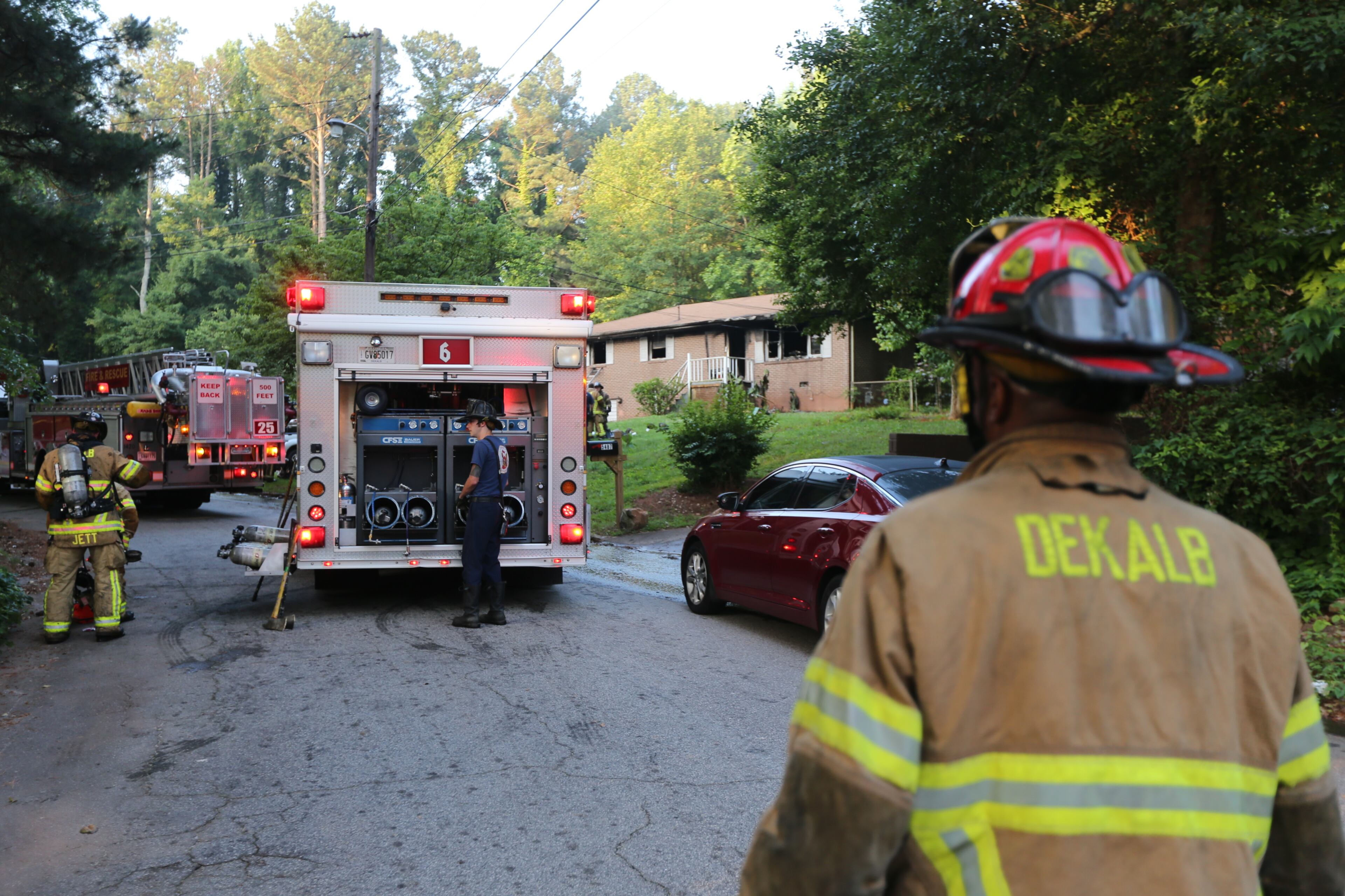 DeKalb County firefighters this morning rescued a woman from a Stone Mountain-area home that caught fire. Fire crews received a report of an entrapment at the home on Stonehaven Way, DeKalb fire Capt. Eric Jackson said. JOHN SPINK/JSPINK@AJC.COM