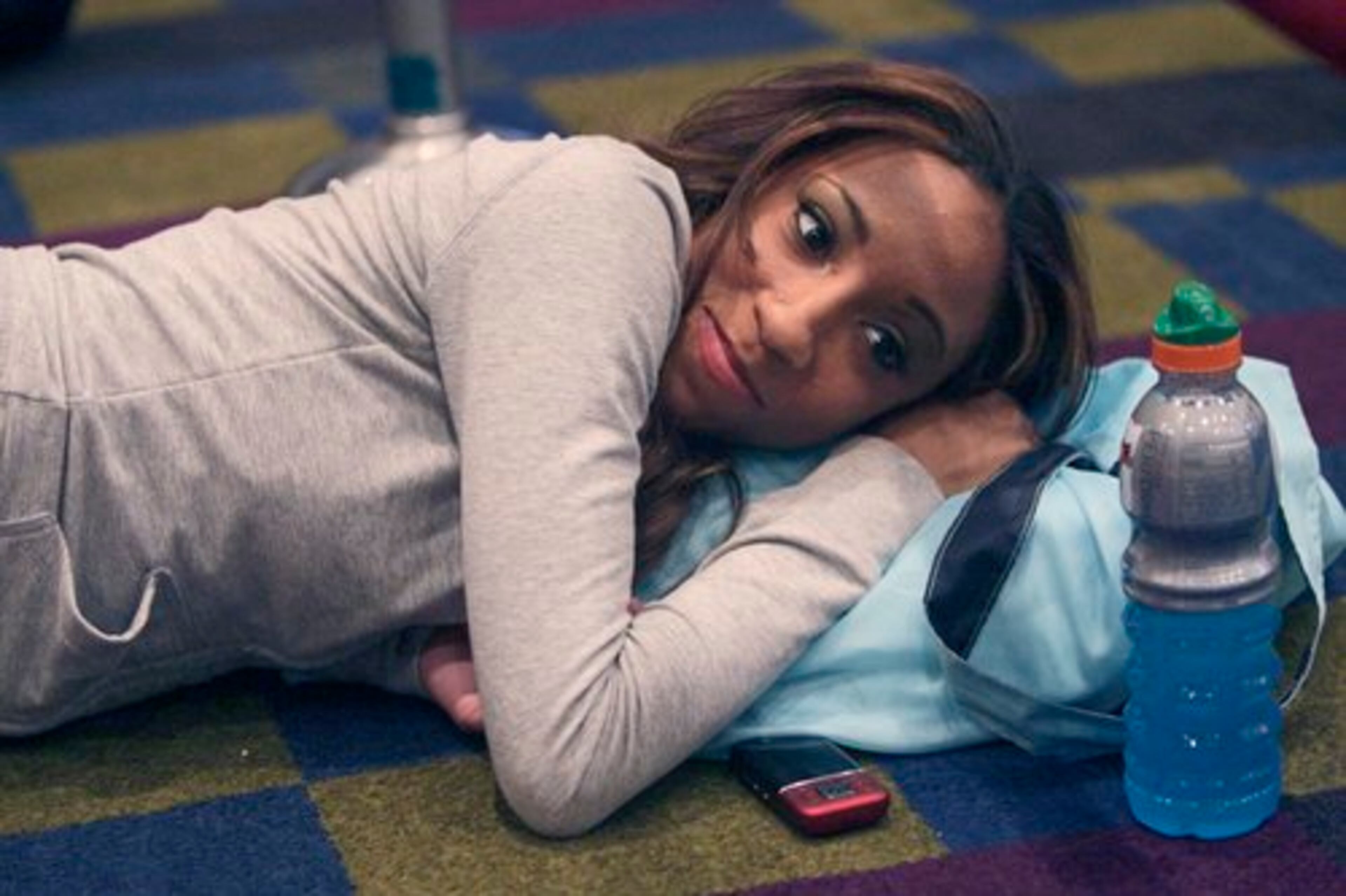 Courtney Butler, 19, from Lithonia, relaxes while waiting for finalists to be announced. Finalists were announced after the second cut, and went on for additional interviews.
