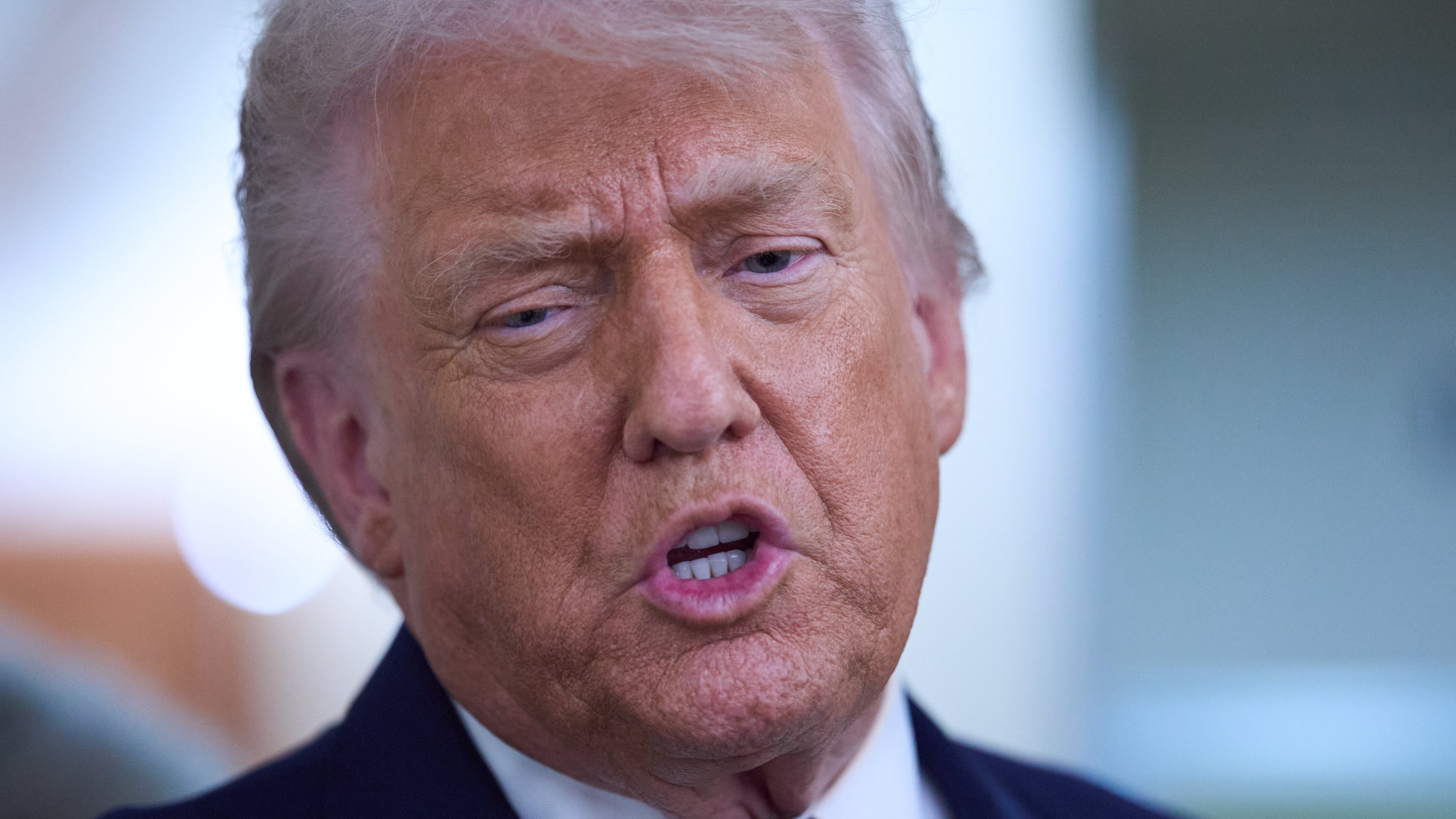 President Donald Trump speaks with reporters aboard Air Force One after leaving the World Economic Forum in Davos for Washington, Thursday, Jan. 22, 2026. (AP Photo/Evan Vucci)