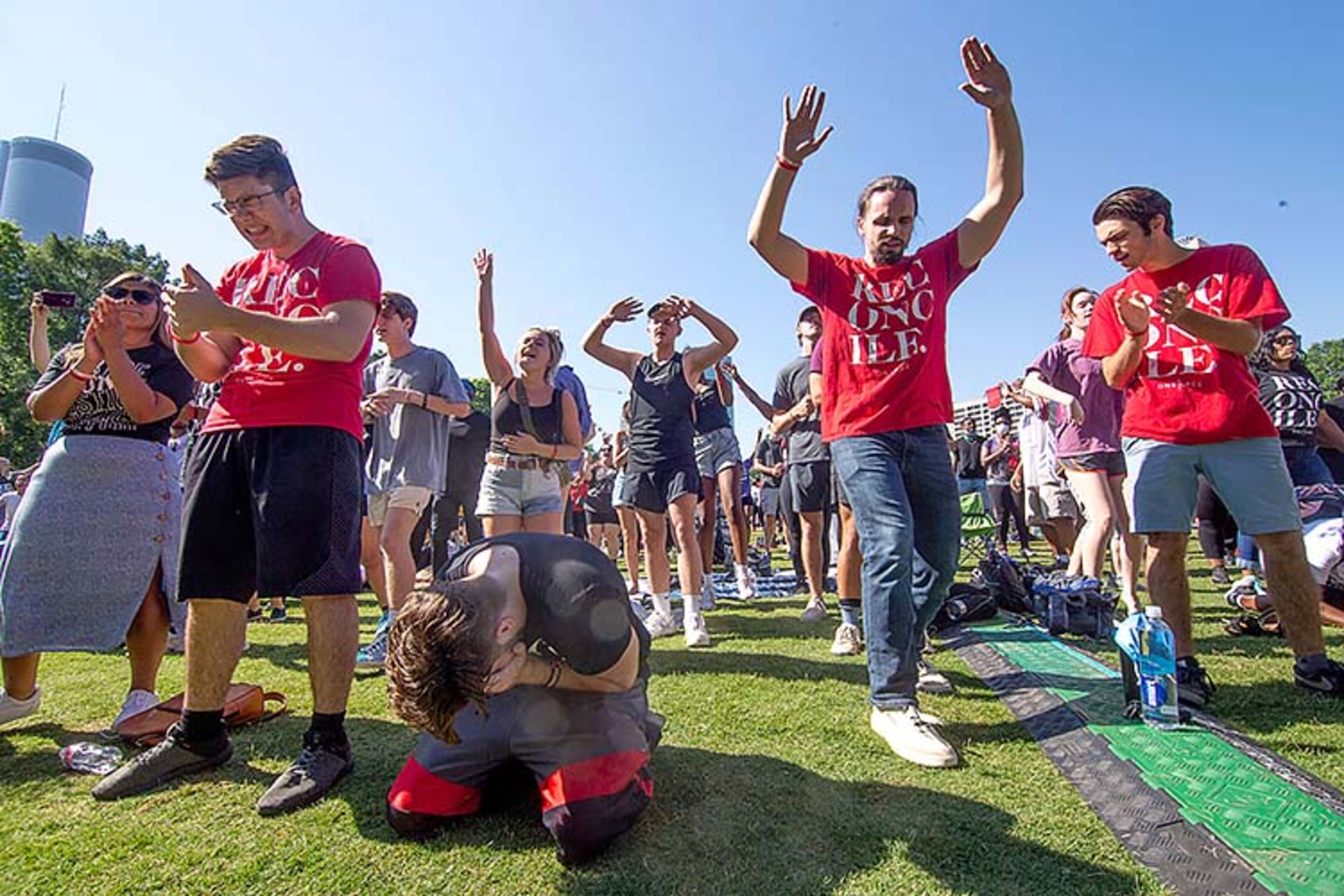 A large crowd gathers at the Centennial Olympic Park stage for an OneRace prayer and worship before marching to the State capital Friday, June 19, 2020. STEVE SCHAEFER FOR THE ATLANTA JOURNAL-CONSTITUTION