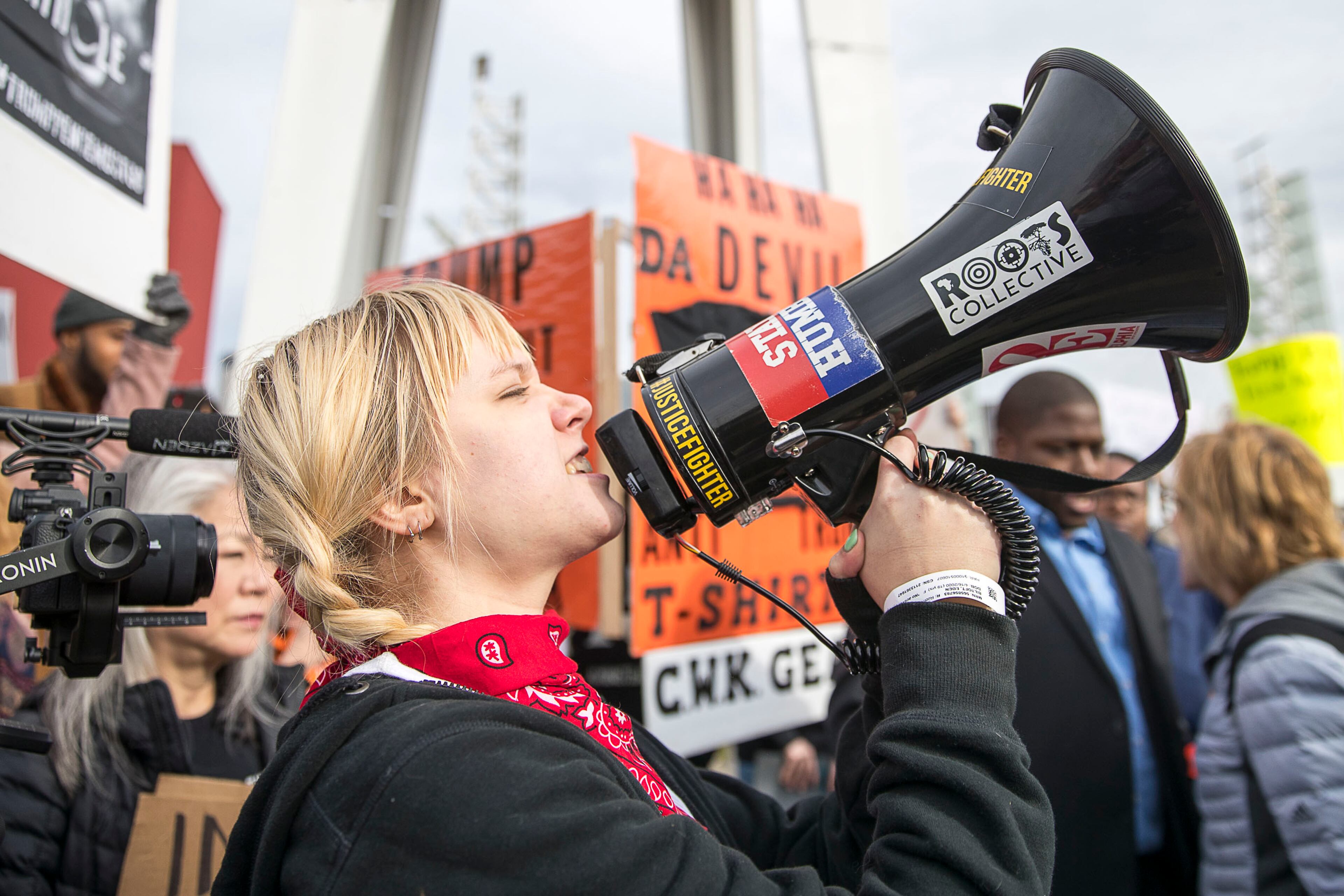 11/08/2019 -- Atlanta, Georgia -- "You can't vote in a fascist society," Edin Biltoft, 19, of Atlanta, yelled into a megaphone during an anti-Trump rally outside of the Georgia World Congress Center in downtown Atlanta, Friday, November 8, 2019. President Trump was in Atlanta on Friday to speak to a crowd of African American voters that support his presidency. (Alyssa Pointer/Atlanta Journal Constitution)