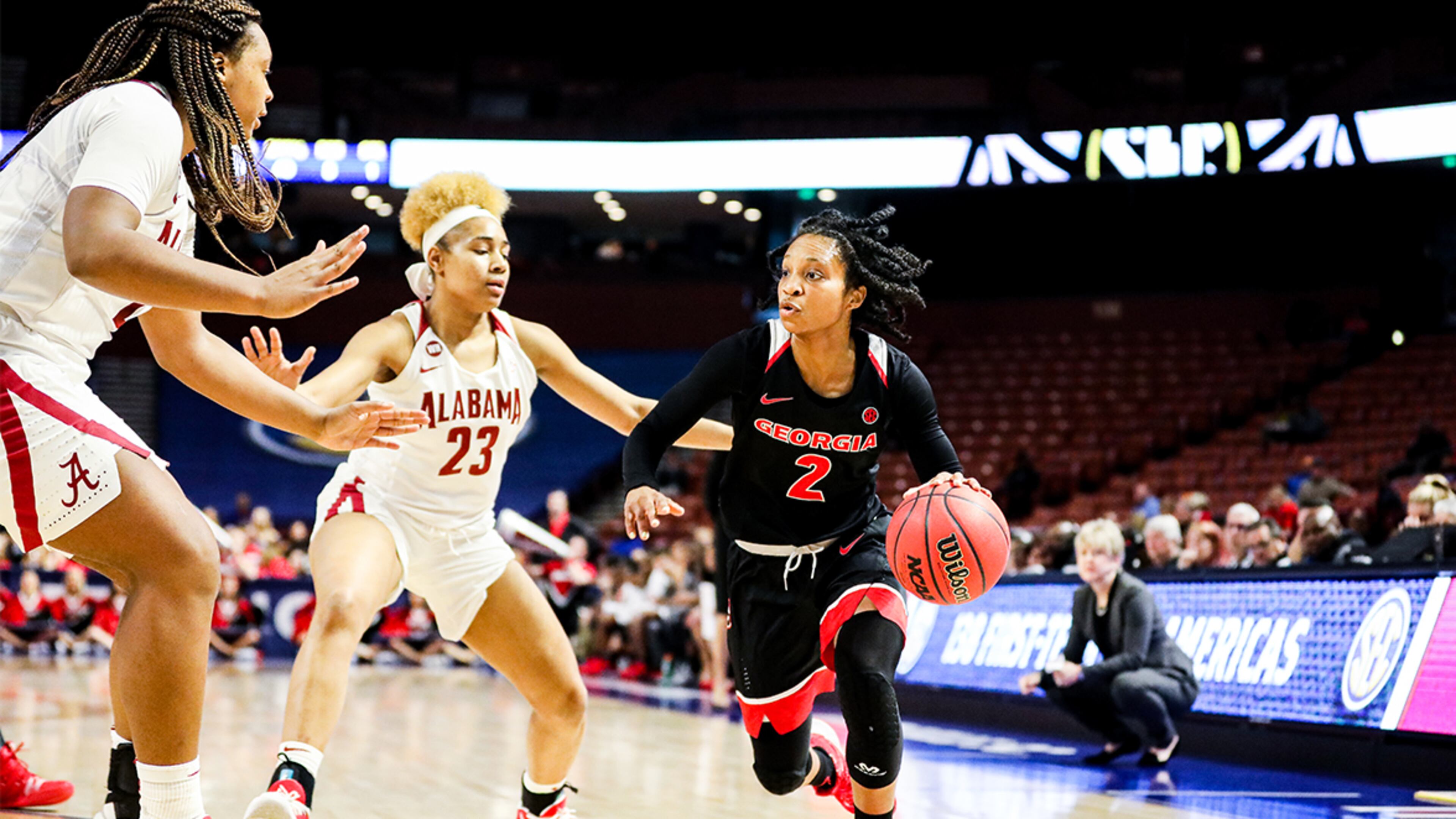 Georgia guard Gabby Connally (2) drives against Alabama defenders during the SEC Women's Basketball Tournament Thursday, March 5, 2020, at the Bon Secours Wellness Arena in Greenville, S.C.