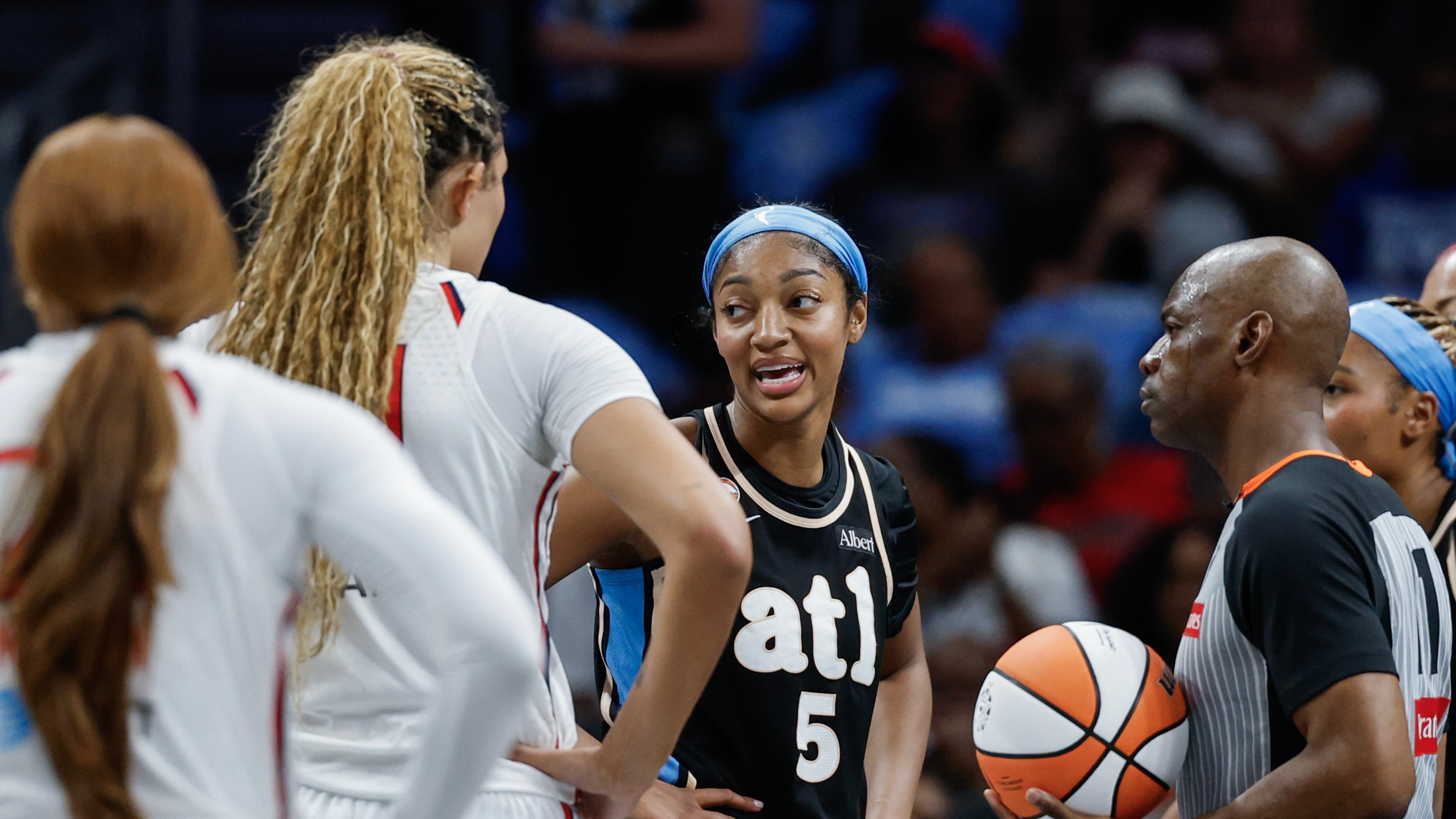 Atlanta Dream forward Angel Reese (5) reacts before a jump ball during the first half of a WNBA first round playoff game one between the Atlanta Dream and the Washington Mystics, Sunday, Sept. 27, 2026, in Atlanta. (Erik S. Lesser for the AJC)