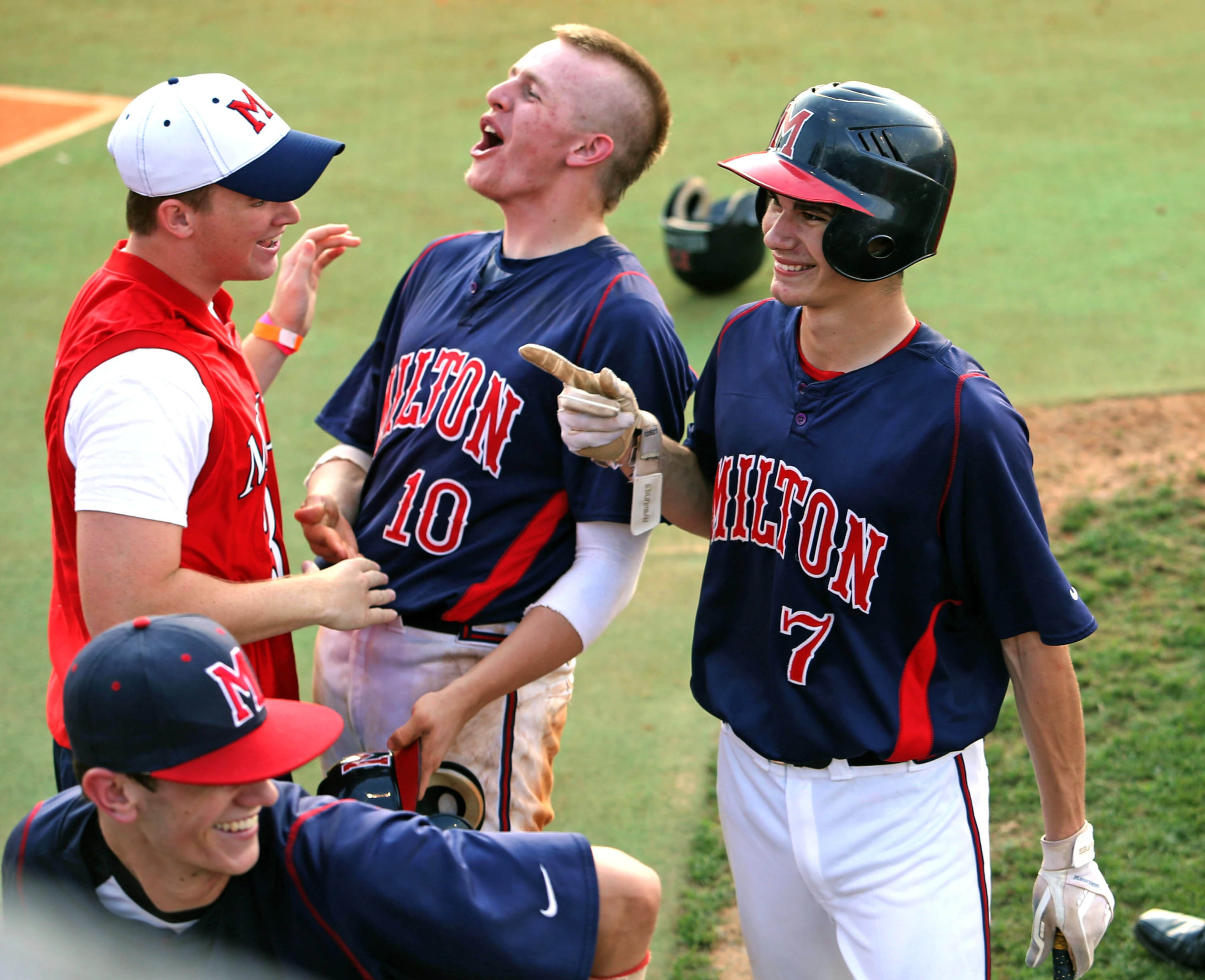 Milton's Jack Thompson (10) and Dylan Cease (7) reacts after Cease hit a home run to end game 3 against Parkview of the Class AAAAAA semi-final at Parkview High School Tuesday afternoon in Lilburn, Ga., May 21, 2013. Milton defeated Parkview to advance to play for the state championship in the series starting Saturday. JASON GETZ / JGETZ@AJC.COM