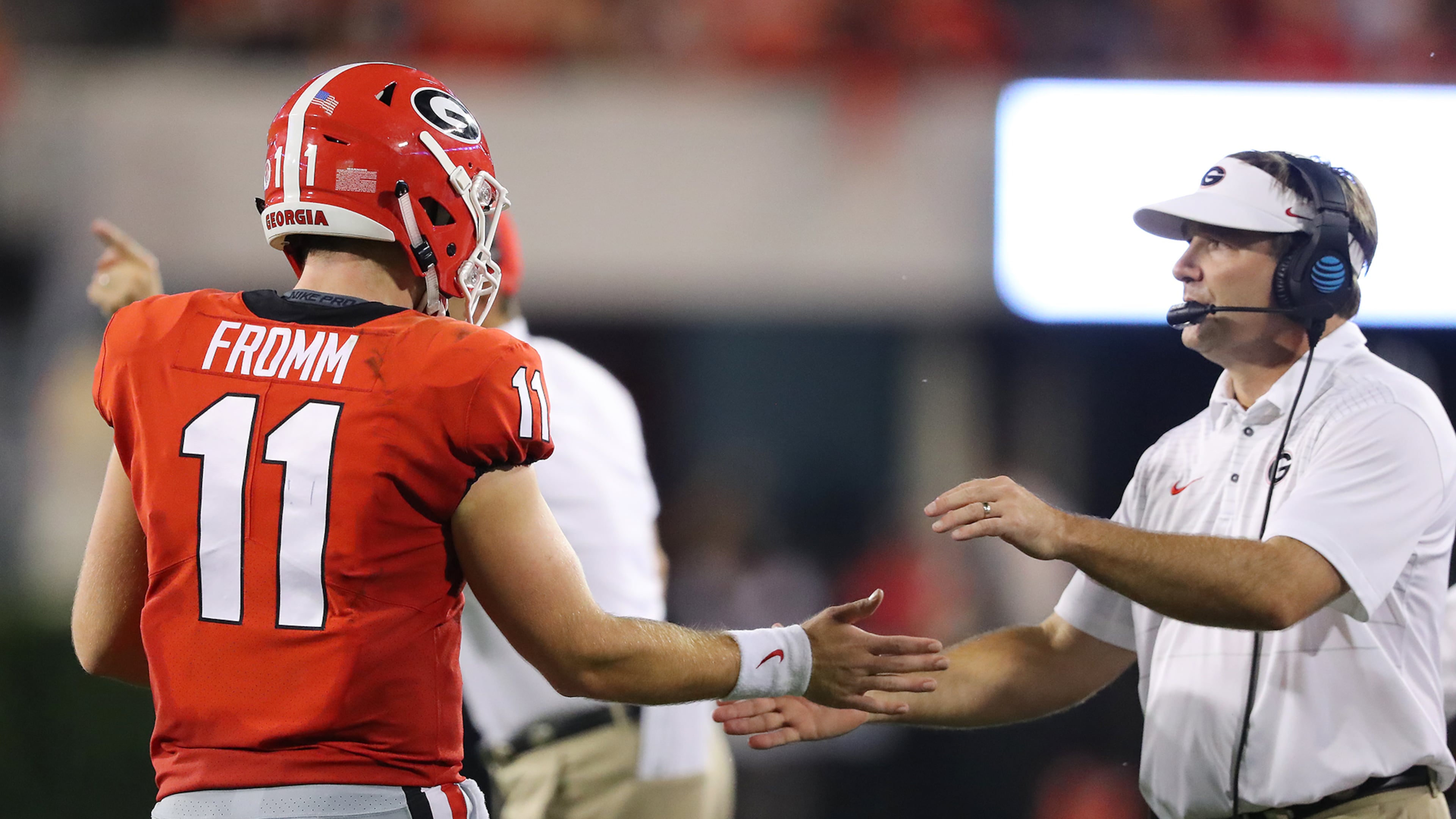 Georgia quarterback Jake Fromm is congratulated by head coach Kirby Smart during last weekend's win over Samford in Athens. Curtis Compton/ccompton@ajc.com