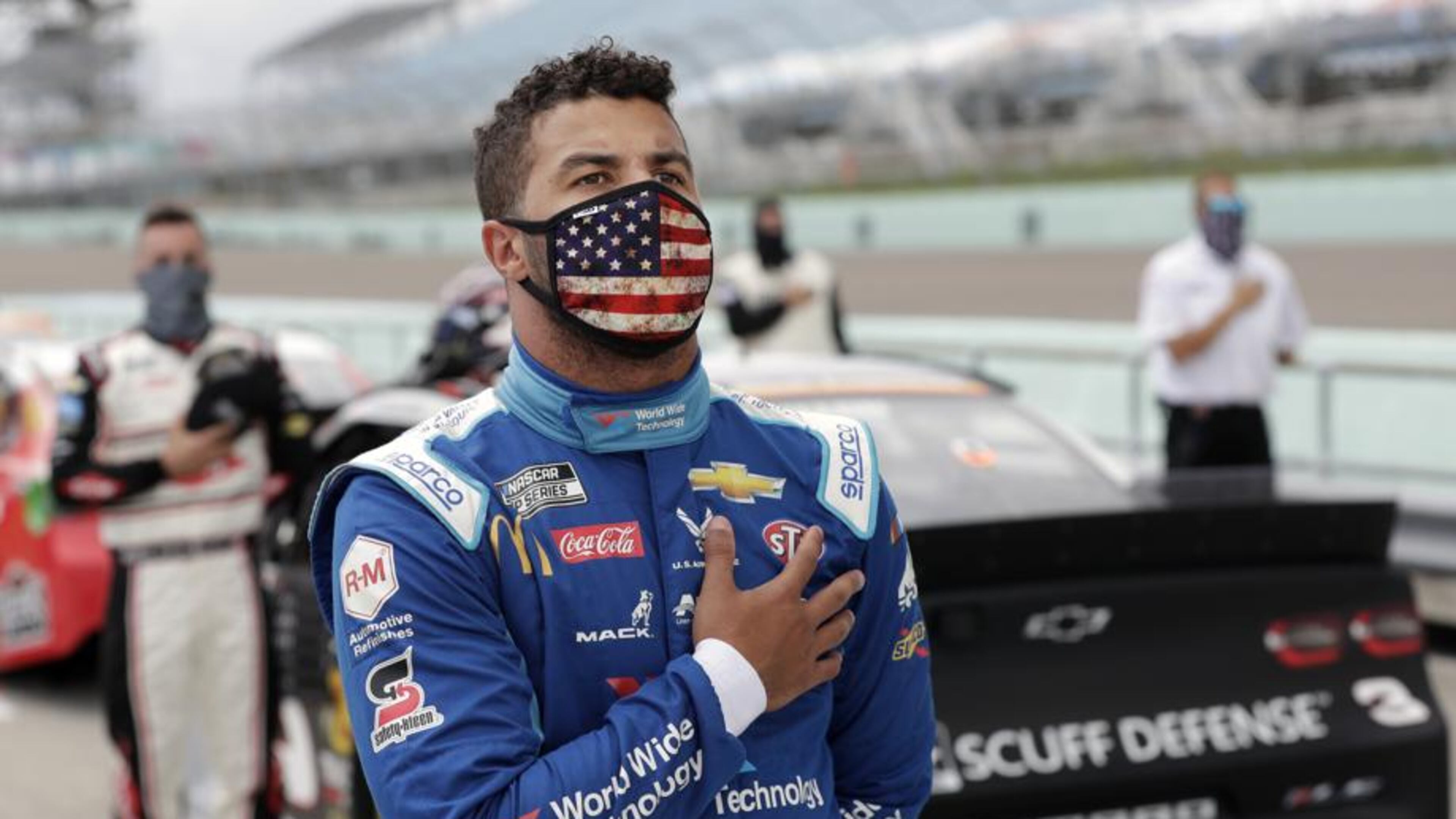 Bubba Wallace stands for the national anthem before a NASCAR Cup Series auto race in June in Florida. AP file photo