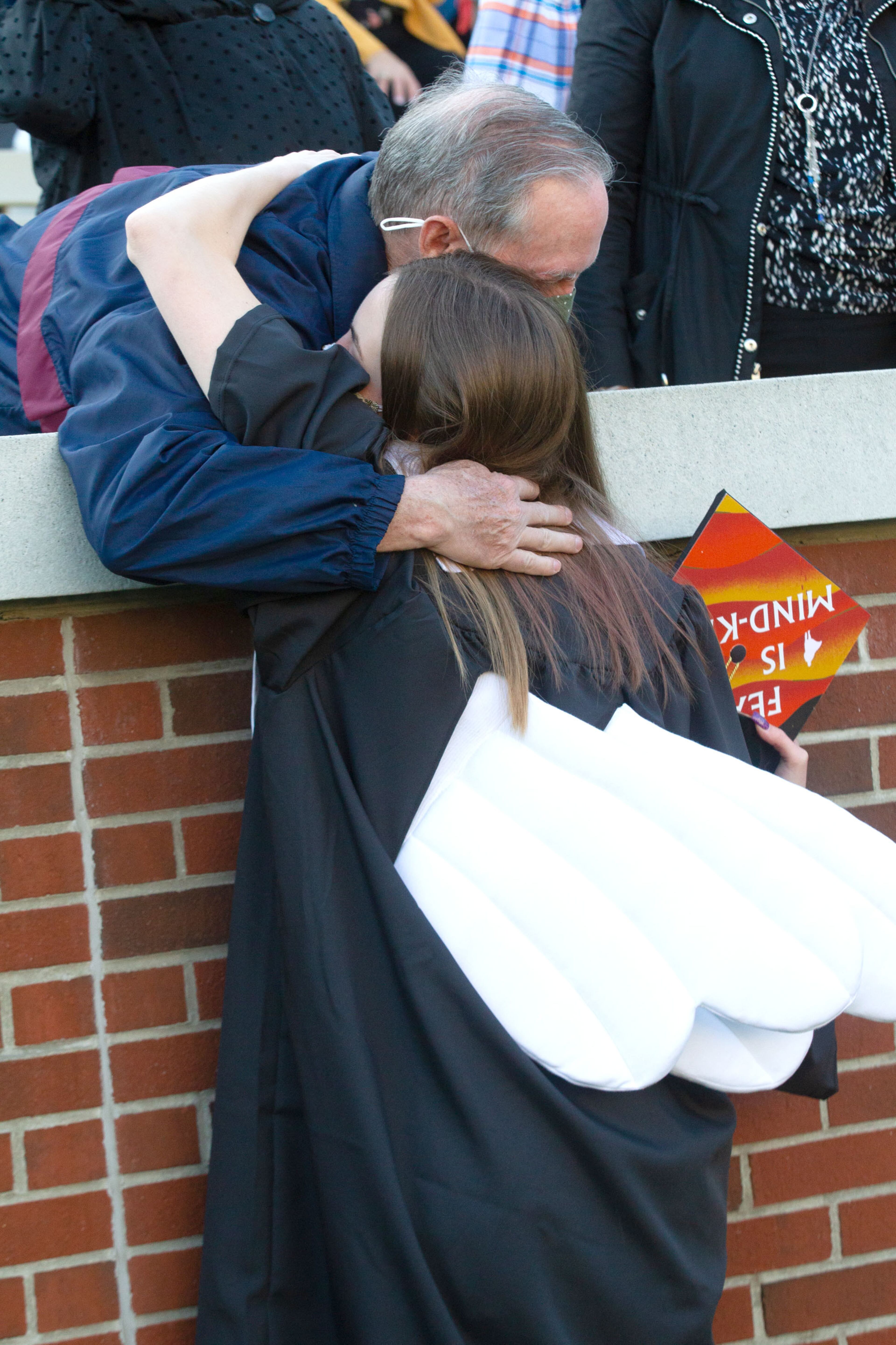 Hannah Donahue gets a hug from her grandfather Steve Titus before the start of the Georgia Tech 2021 commencement ceremony in Bobby Dodd Stadium on Saturday, May 8, 2021. Two ceremonies were held Saturday for bachelor’s degree recipients, and master's and doctoral graduates' ceremonies were held Friday. (Photo: Steve Schaefer for The Atlanta Journal-Constitution)