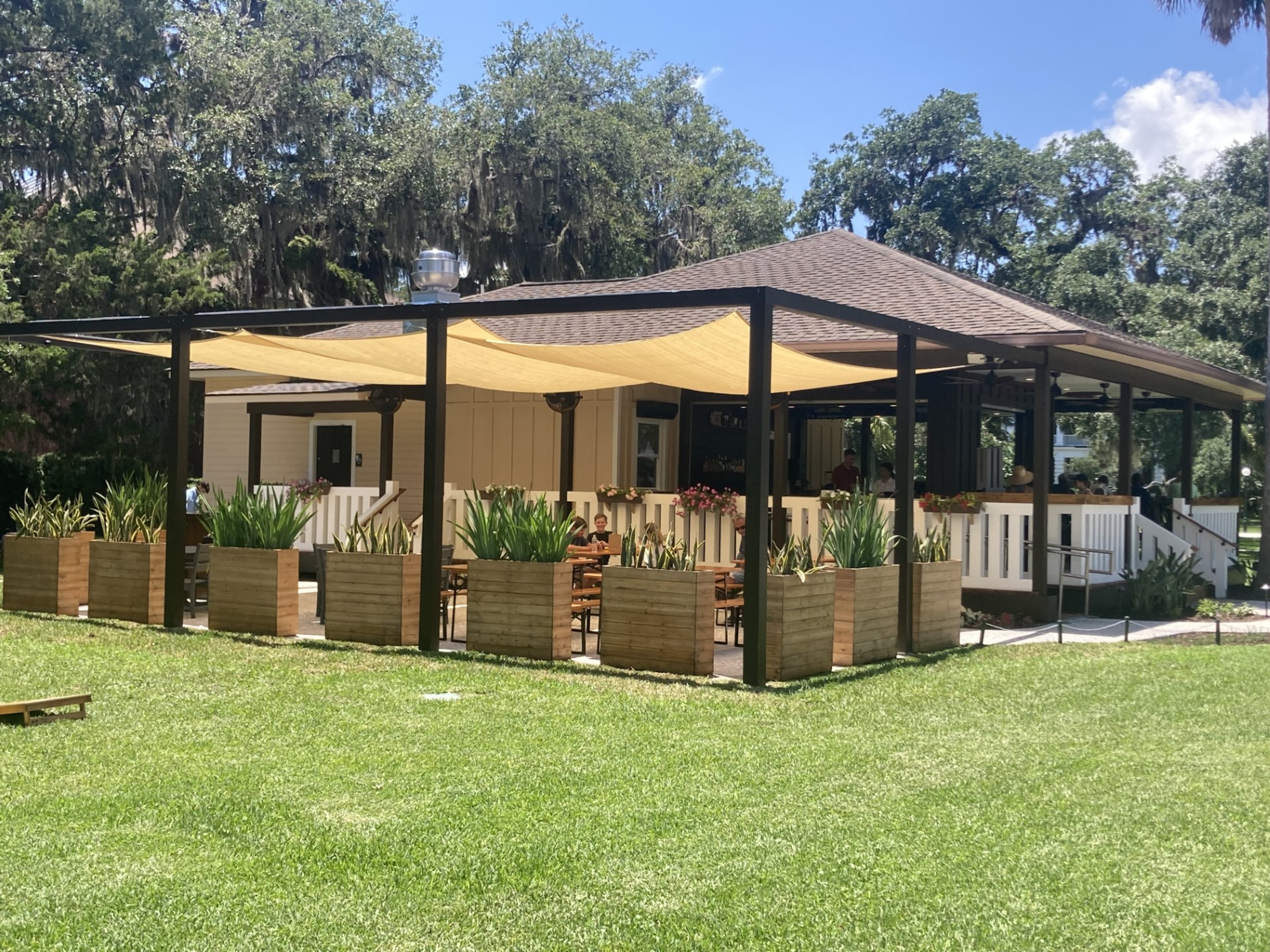 The biergarten at Founders Social is the centerpiece of Jekyll Island's The District Shops. (Adam Van Brimmer/AJC)