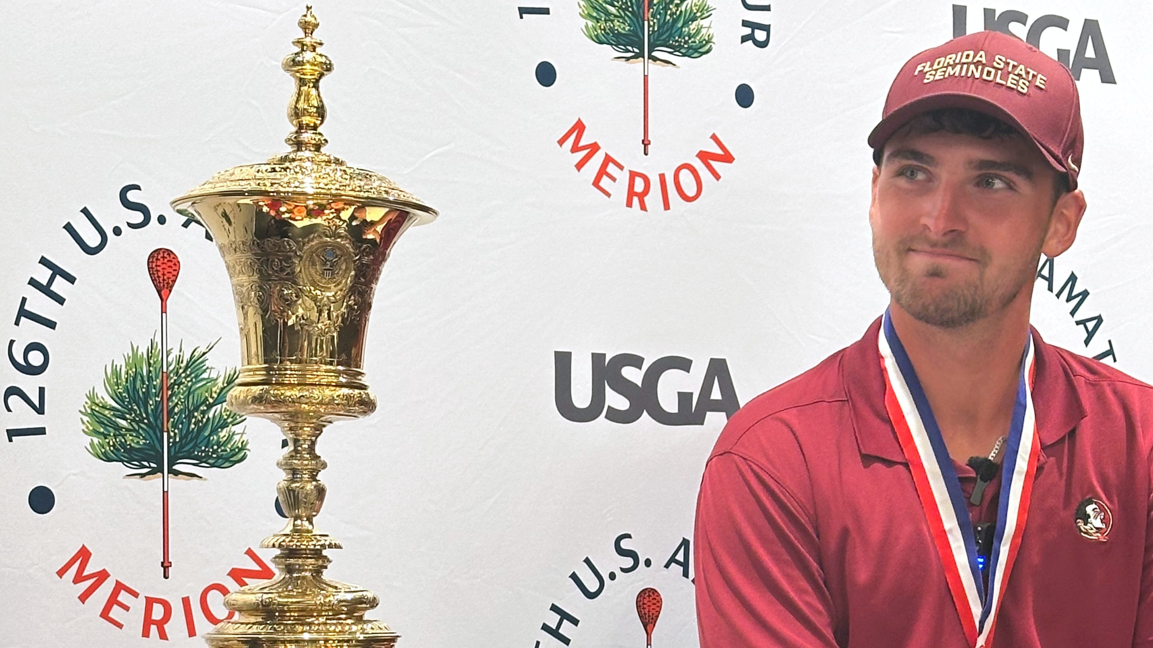 Jack Whaley admires his US Amateur golf championship trophy Sunday, Aug. 16, 2026, at Merion Golf Club in Ardmore, Pa. (AP Photo/Dan Gelston)
