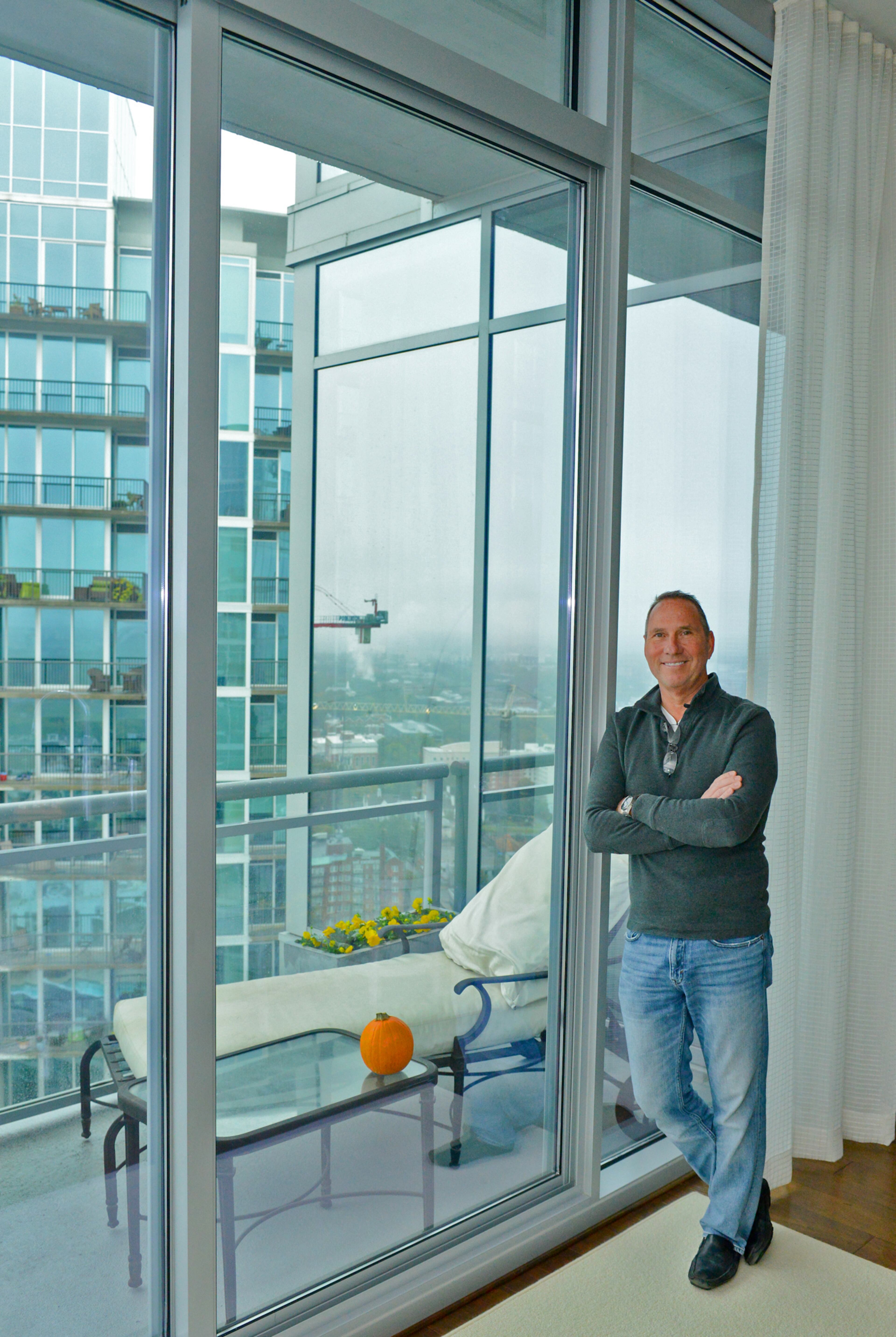 Entrepreneur Jim Wilson moved into the 1065 Midtown high rise in 2015, after eyeing the property for five years. "You can't beat the location," he says. The Midtown unit combines the amenities of the Lowe's Atlanta Hotel in the same building with the privacy of a condo.