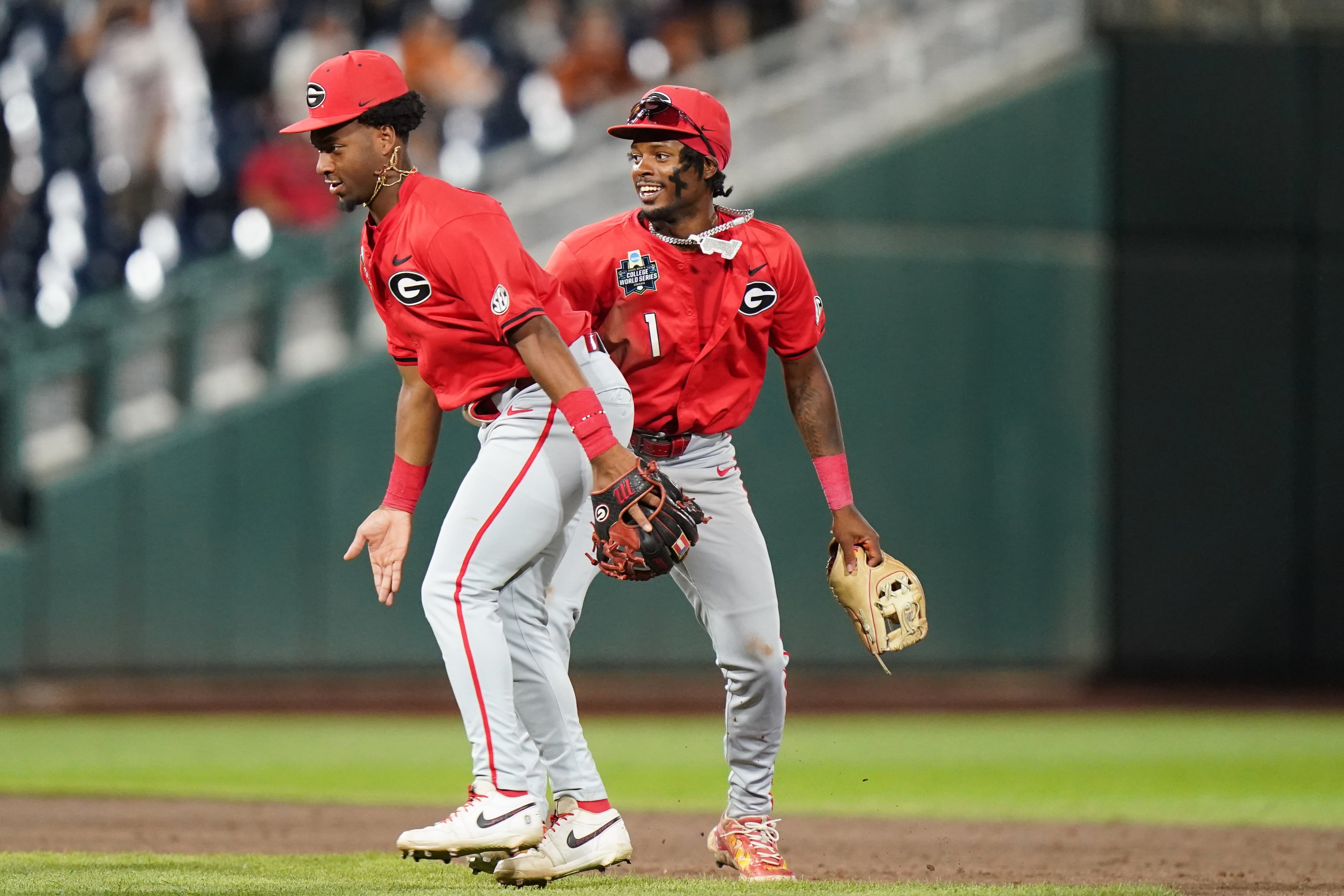 Georgia teammates celebrate after an NCAA baseball College World Series elimination game against Texas, Tuesday, June 16, 2026 in Omaha, Neb. Georgia won 2-0. (AP Photo/Vera Nieuwenhuis)