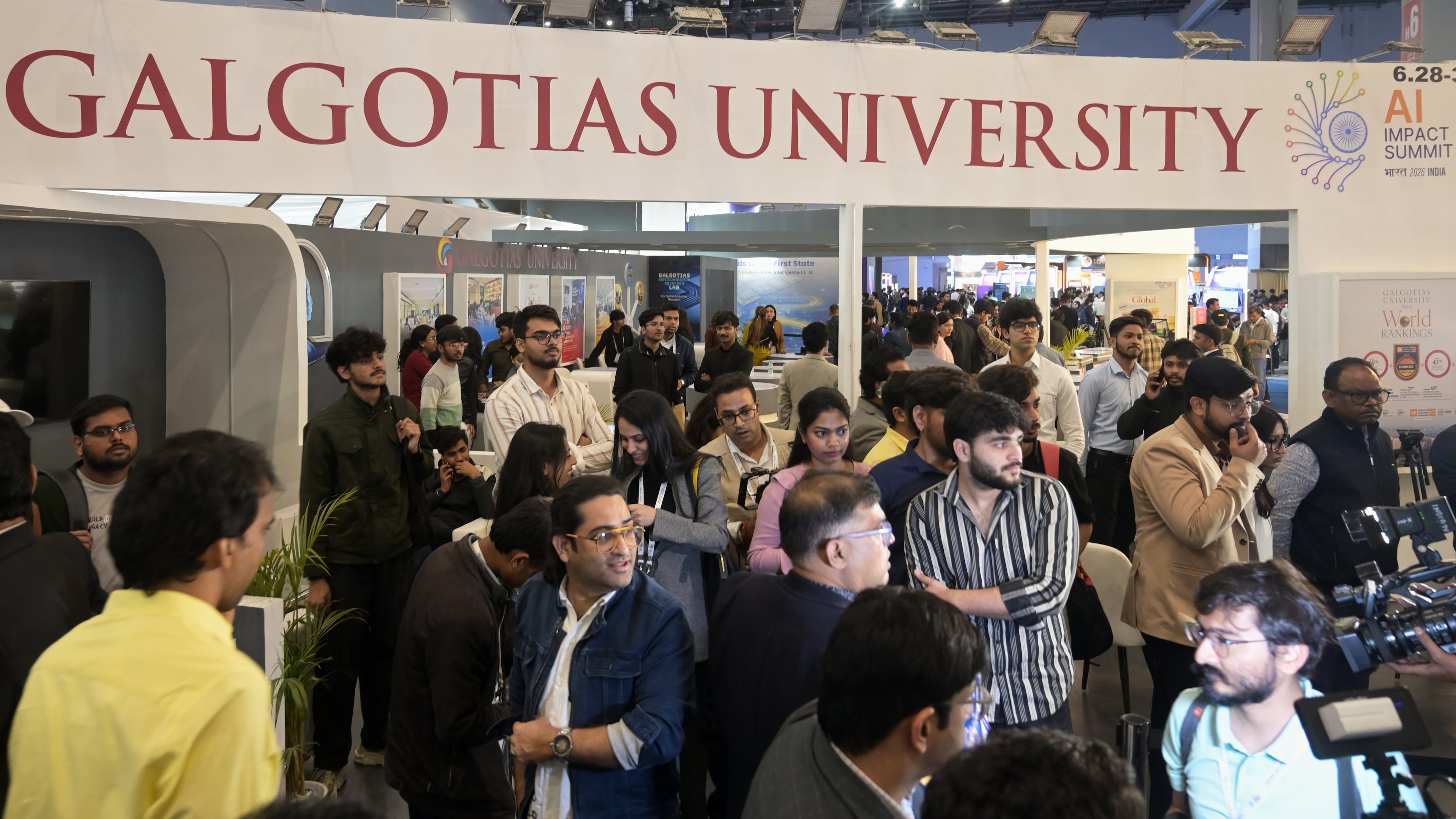 People visit Galgotias University stall at AI summit ahead of an eviction order issued by Indian authorities, in New Delhi, India, Wednesday, Feb. 18, 2026. (AP Photo)