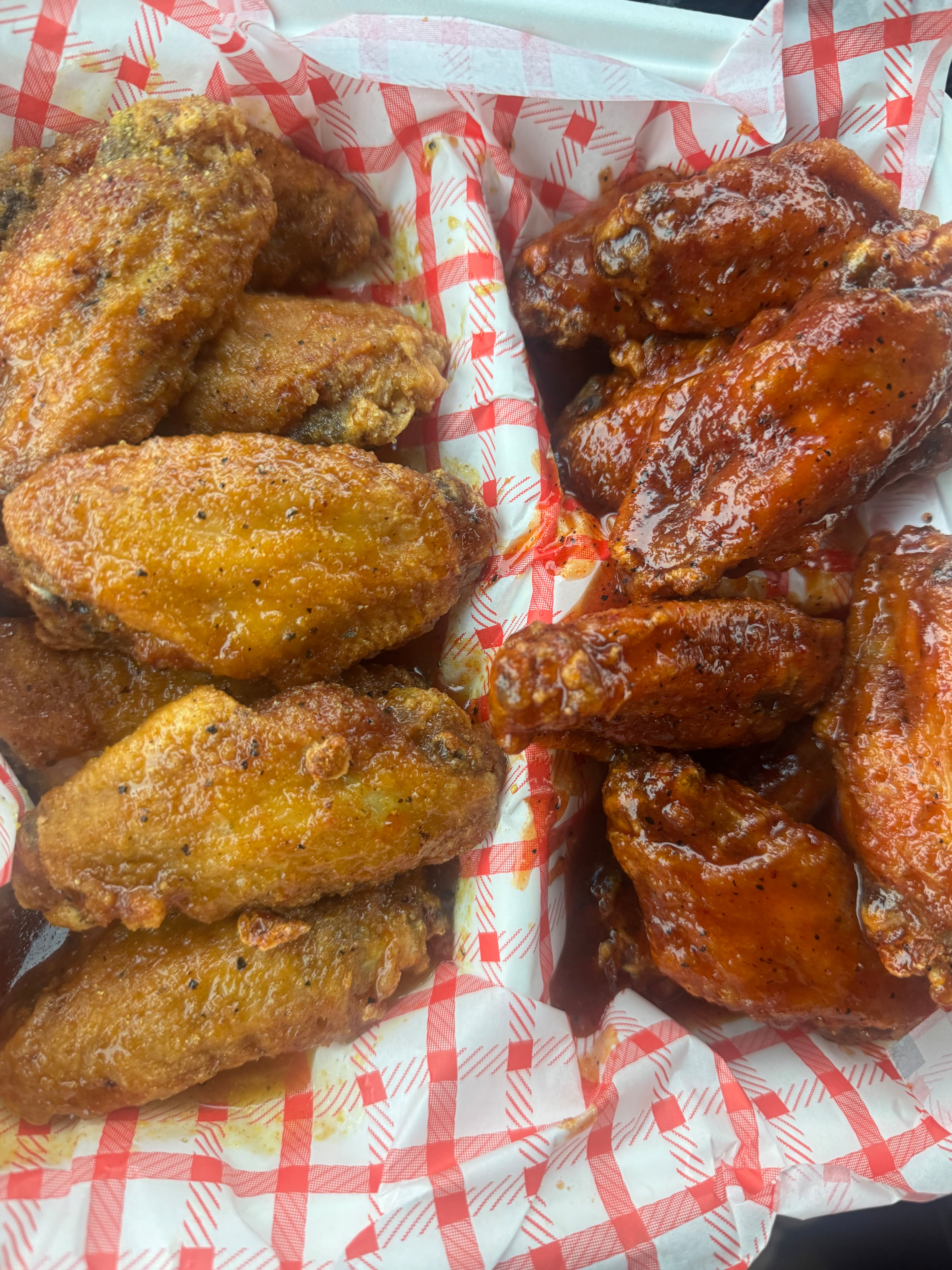 A half-and-half order from Buffalo Bar featuring honey hot lemon pepper and honey hot flavors. (Justin Brown for the AJC)