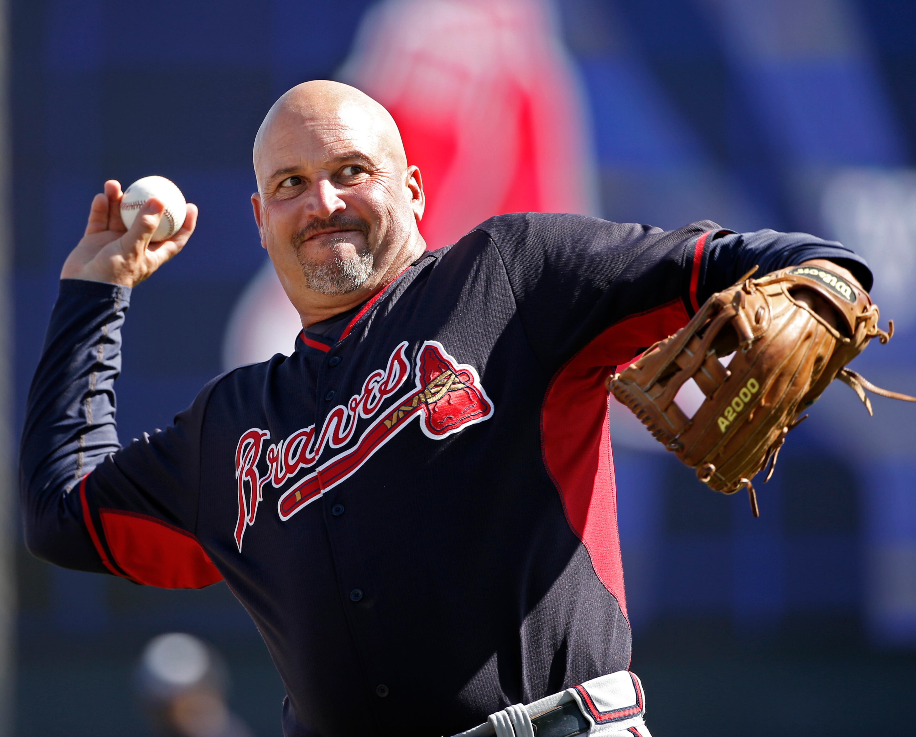 Atlanta Braves manager Fredi Gonzalez throws a before a spring exhibition baseball game in Tampa, Fla., Sunday, March 16, 2014. (AP Photo/Kathy Willens)