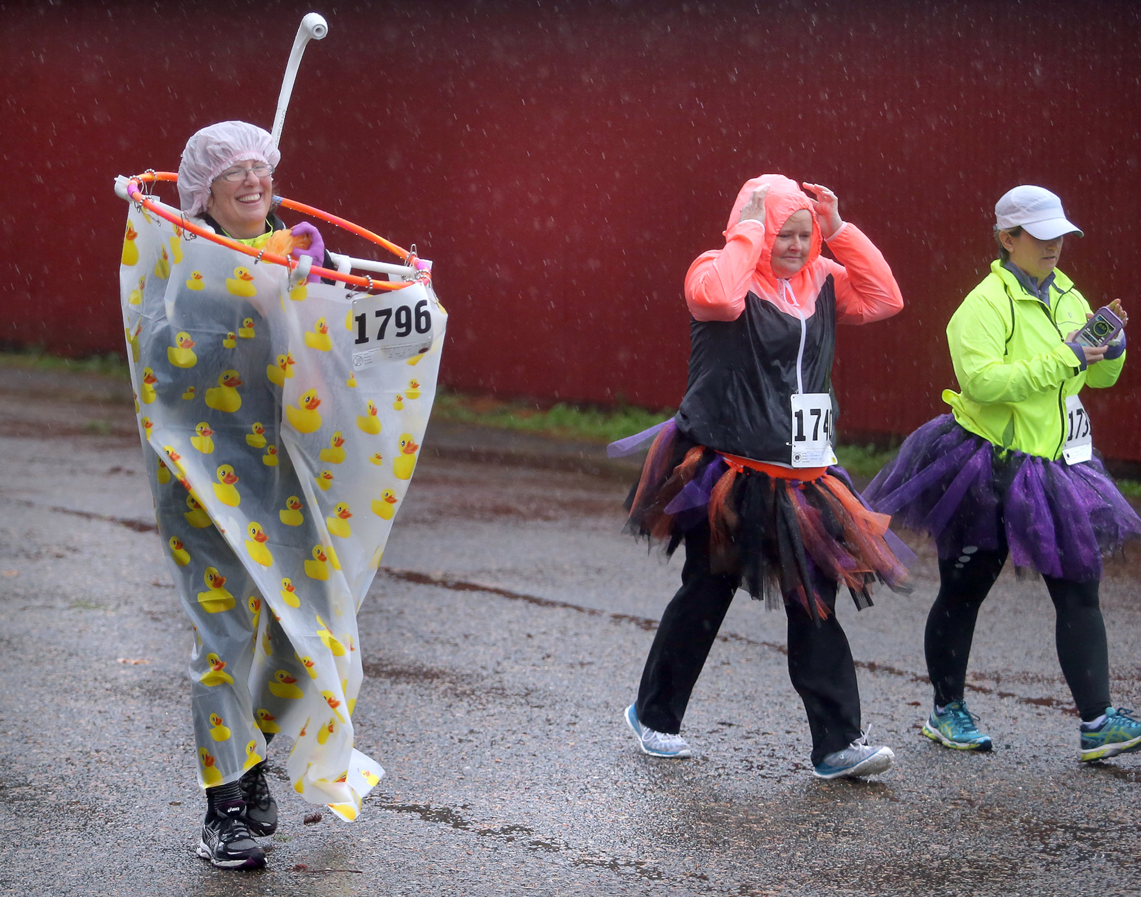Kelly Donegan, left, participates during the Halloween Fun Run at the Kitsap County Fairgrounds in Silverdale, Wash., Saturday, Oct. 31, 2015. (Larry Steagall/Kitsap Sun via AP) MANDATORY CREDIT