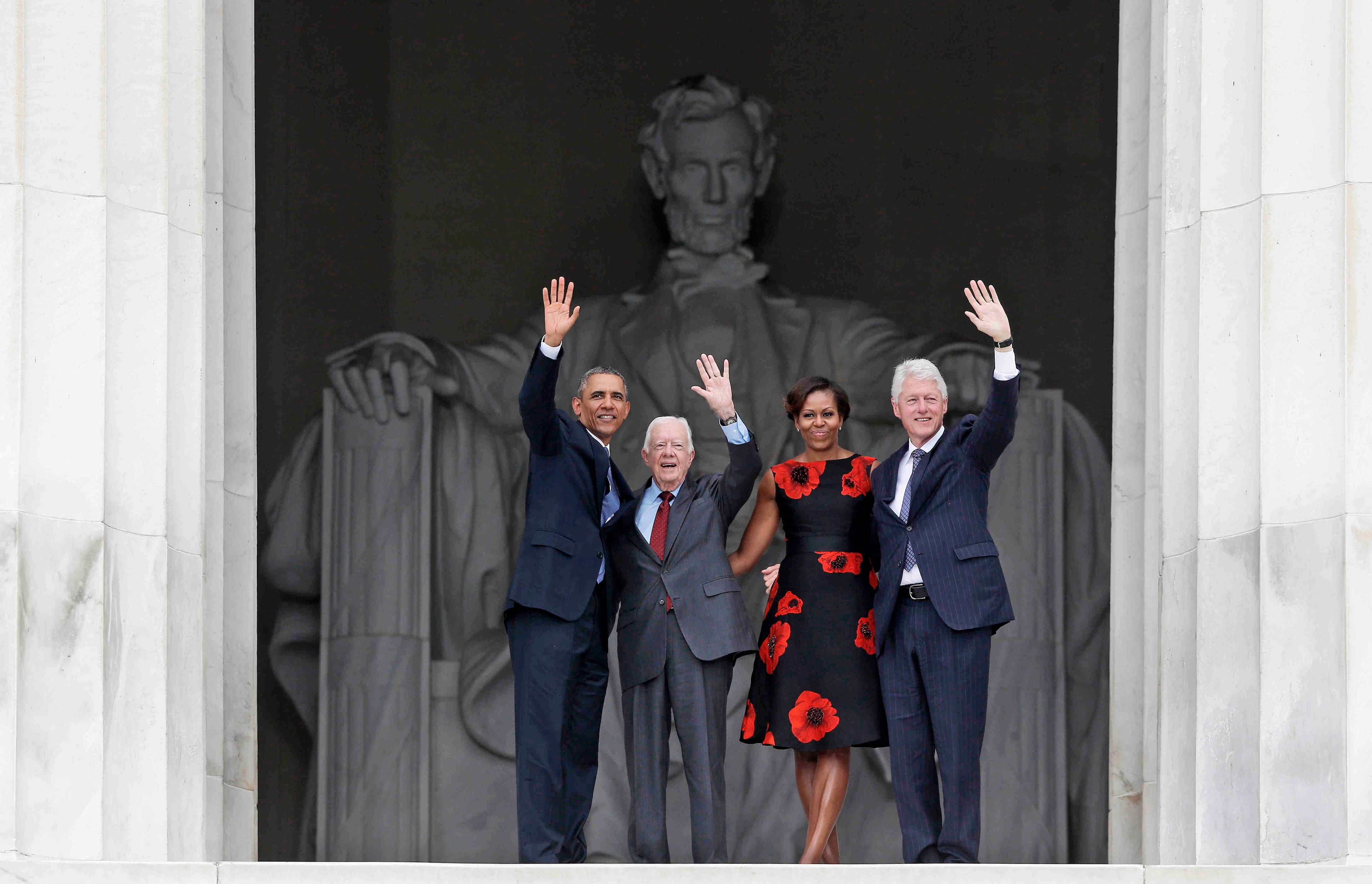 President Barack Obama, first lady Michelle Obama, former President Jimmy Carter and former President Bill Clinton wave as they leave 50th Anniversary of the March on Washington where Martin Luther King Jr., spoke, Wednesday, Aug. 28, 2013, at the Lincoln Memorial in Washington. (AP Photo/Charles Dharapak)