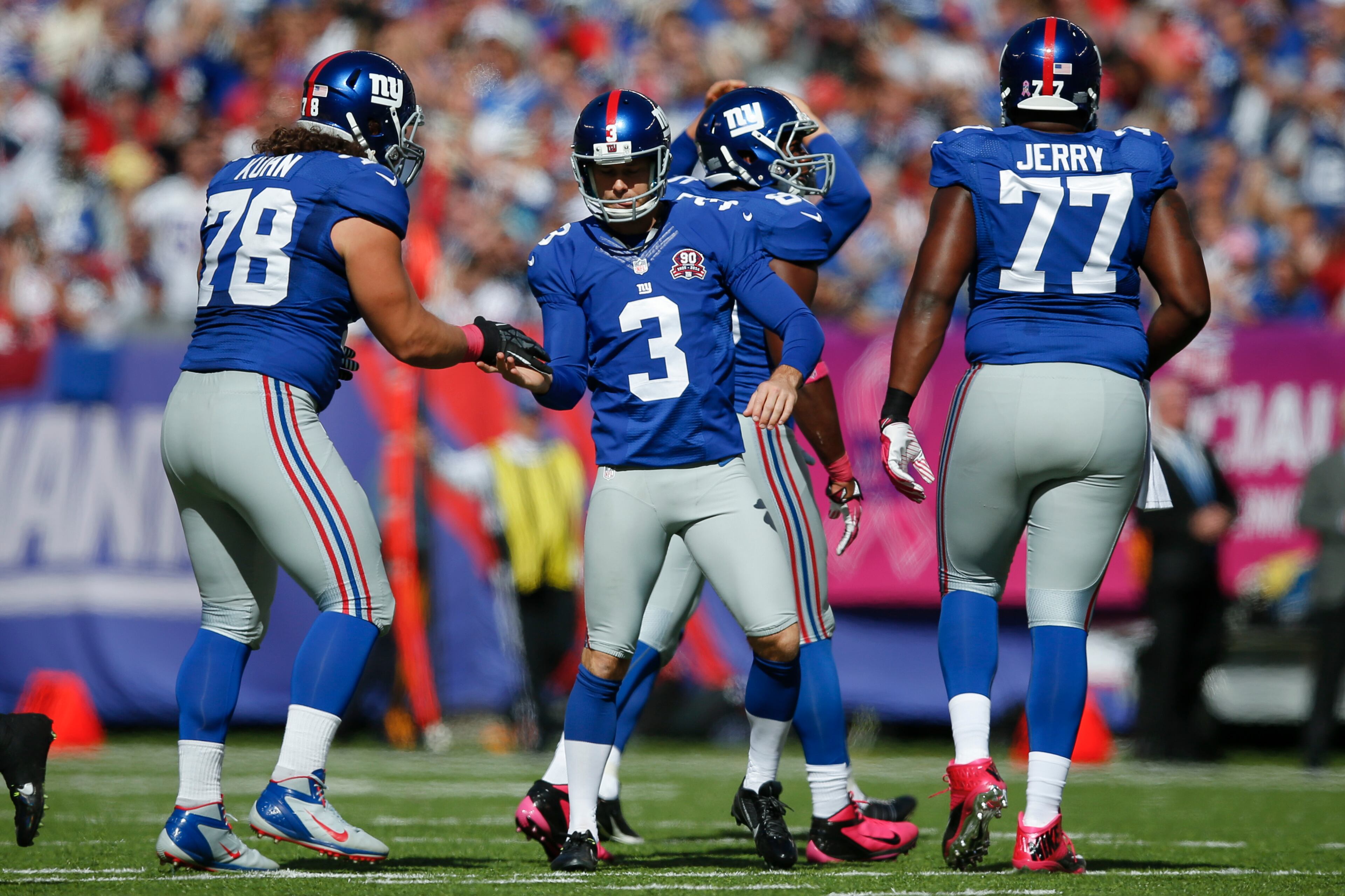 New York Giants kicker Josh Brown (3) is congratulated by defensive tackle Markus Kuhn (78) after kicking a field goal against the Atlanta Falcons during the first half of an NFL football game, Sunday, Oct. 5, 2014, in East Rutherford, N.J. (AP Photo/Kathy Willens)