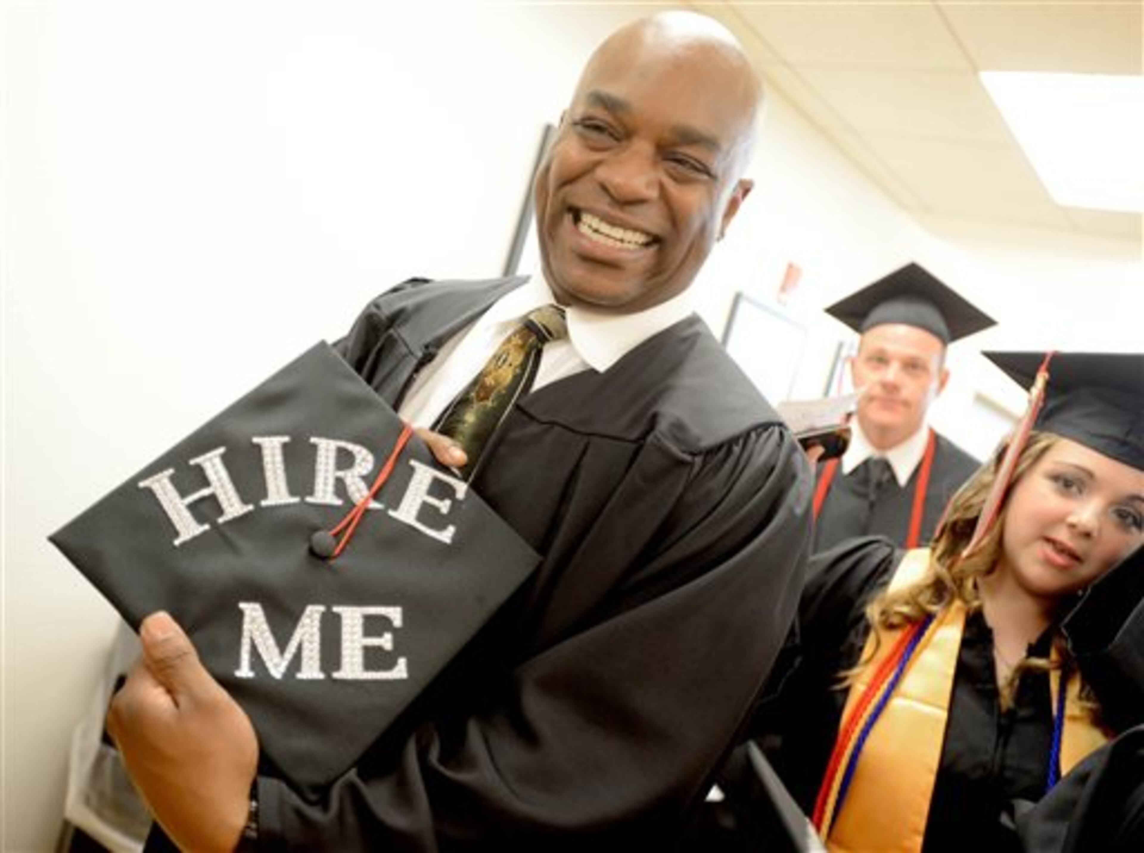 Jerome Tucker shows off his cap before commencement ceremonies on Saturday, May 10, 2014, at Northwest Florida State College in Niceville, Fla. (AP Photo/Northwest Florida Daily, Nick Tomecek)