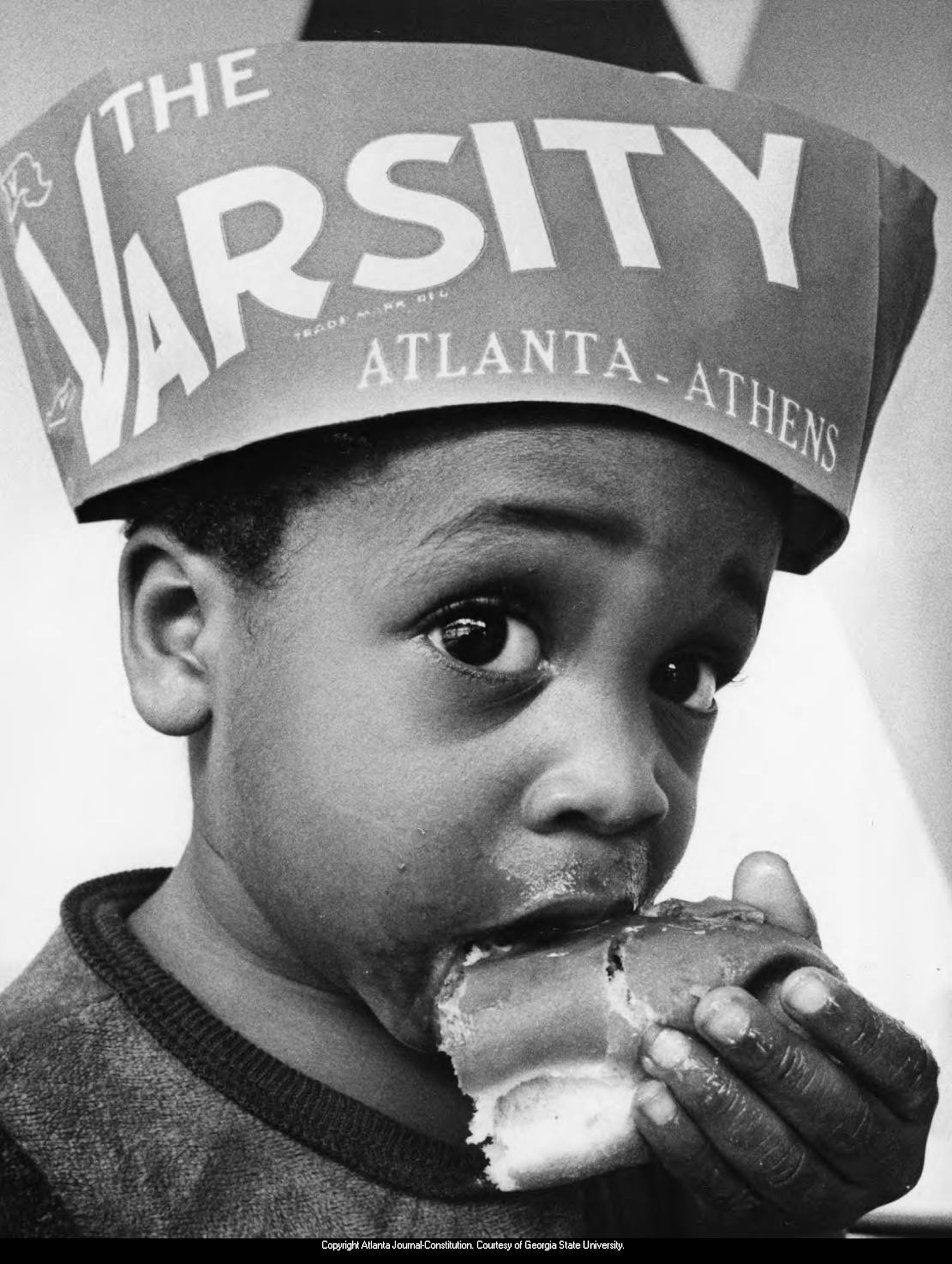 "What'll ya have?"
September 6 1980-Shouinard Jones, 18-months-old, bites into a hot dog from the Varsity in Atlanta, Georgia. The Varsity originally opened in 1938 and has steadily grown into an Atlanta institution. On Georgia Tech games days, the eatery can host up to 30,000 people. They are best known for their Frosted Orange and chili cheese dogs.
Atlanta Journal-Constitution Archive