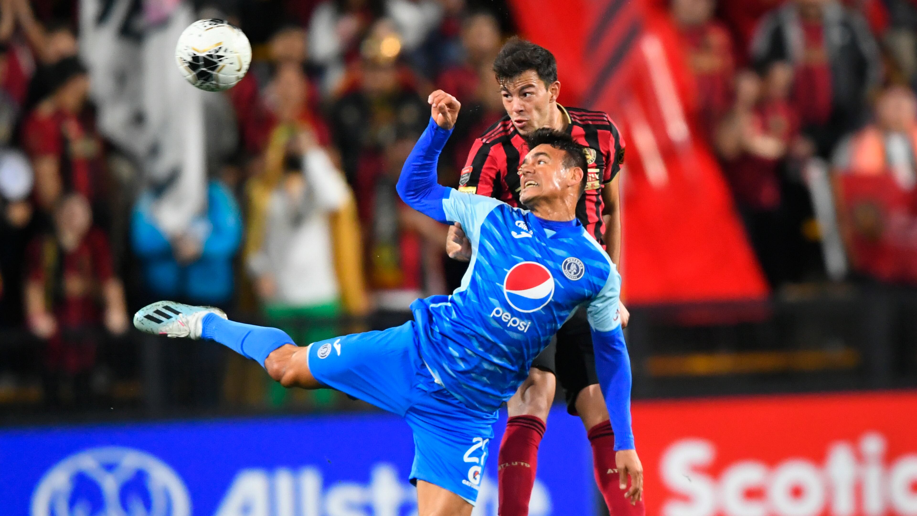 Roberto Aldana of the Motagua FC (front) and Fernando Meza battle for a header during the first half of soccer in the Scotiabank Concacaf Champions League, Tuesday, Feb. 25, 2020, in Kennesaw, Ga. (John Amis, Atlanta Journal Constitution)