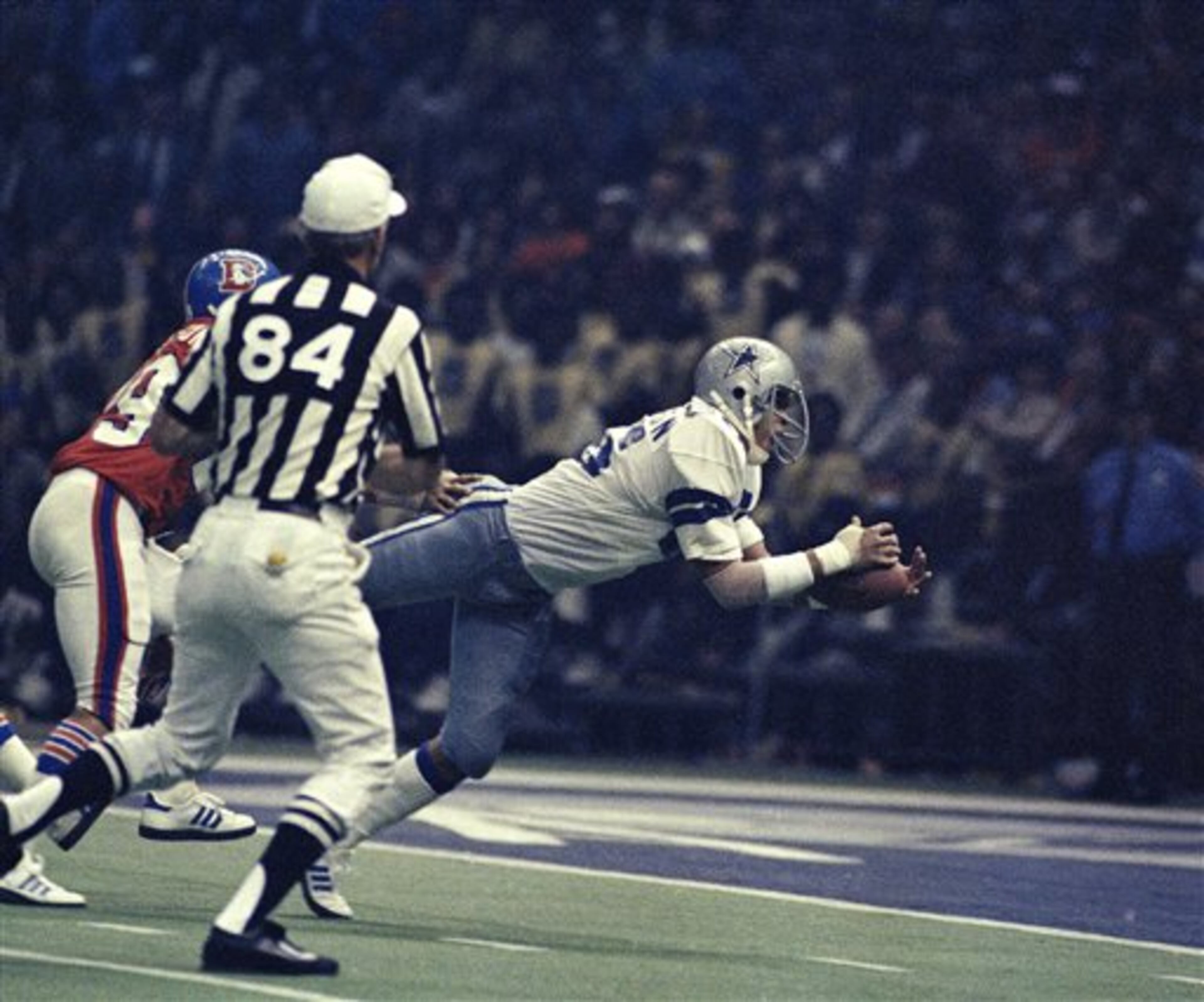 Dallas wide receiver Butch Johnson shown landing on one elbow in the end zone after hauling down a 45-yard pass from quarterback Roger Staubach in third quarter action of Superbowl XII, January 15, 1978. Dallas beat Denver, 27 to 10 in the superdome in New Orleans. (AP Photo)
