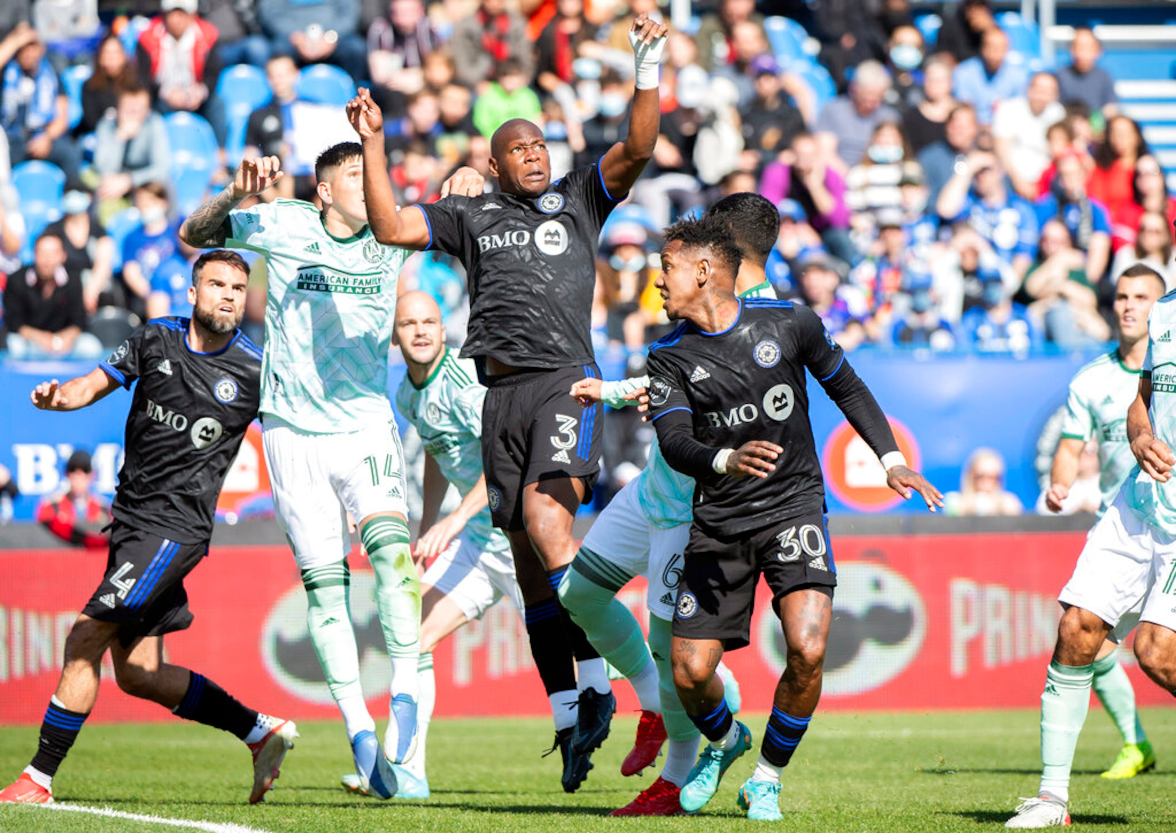 CF Montreal's Kamal Miller (3) goes up for the ball and scores against Atlanta United during the first half of a MLS soccer game in Montreal, Saturday, April 30, 2022. (Graham Hughes/The Canadian Press via AP)