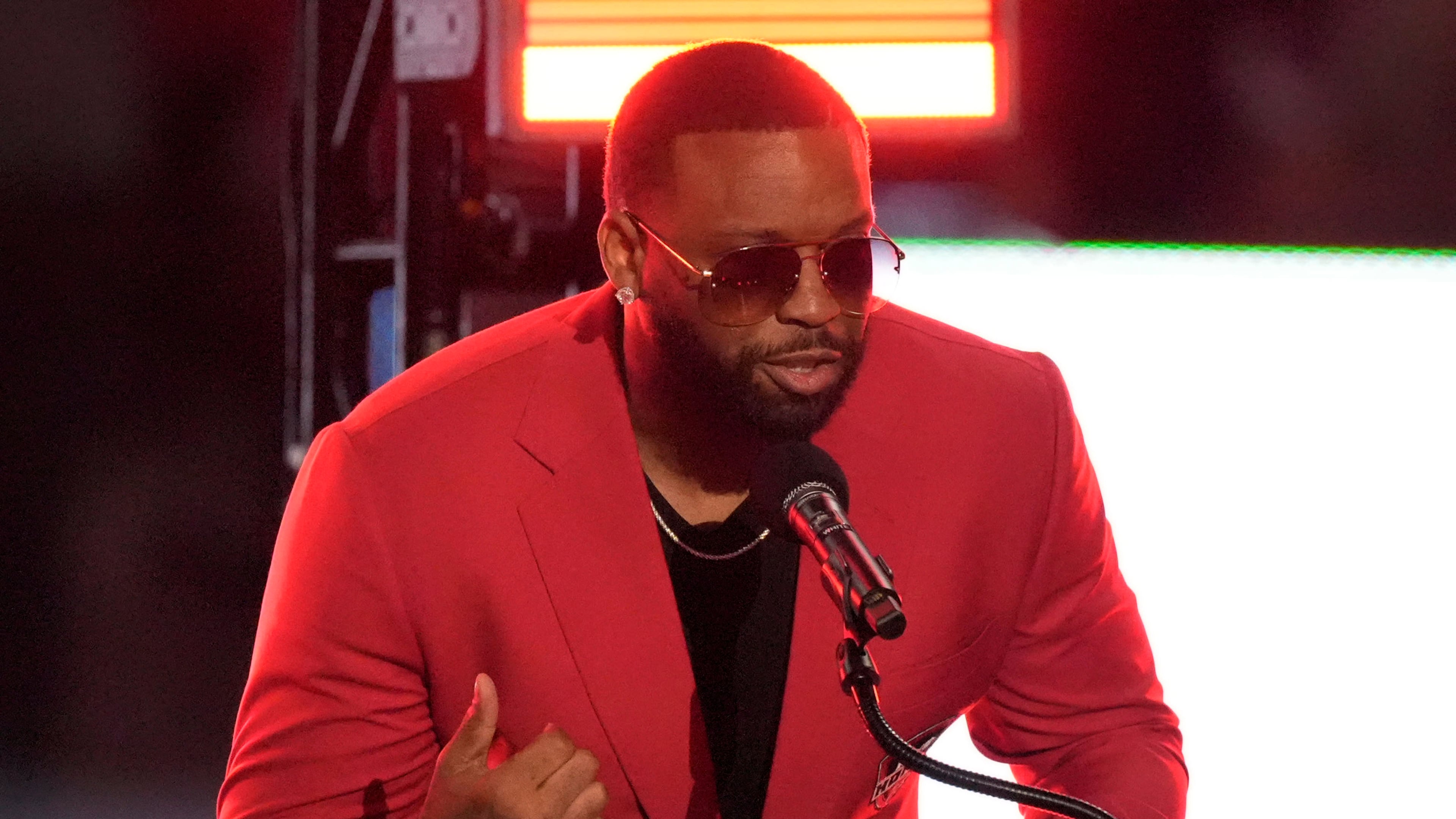 Former Atlanta Falcons defensive end John Abraham speaks during his Ring of Honor Induction Ceremony during halftime of an NFL football game between the Falcons and the Baltimore Ravens, Sunday, Oct. 11, 2026, in Atlanta. (AP Photo/Mike Stewart)