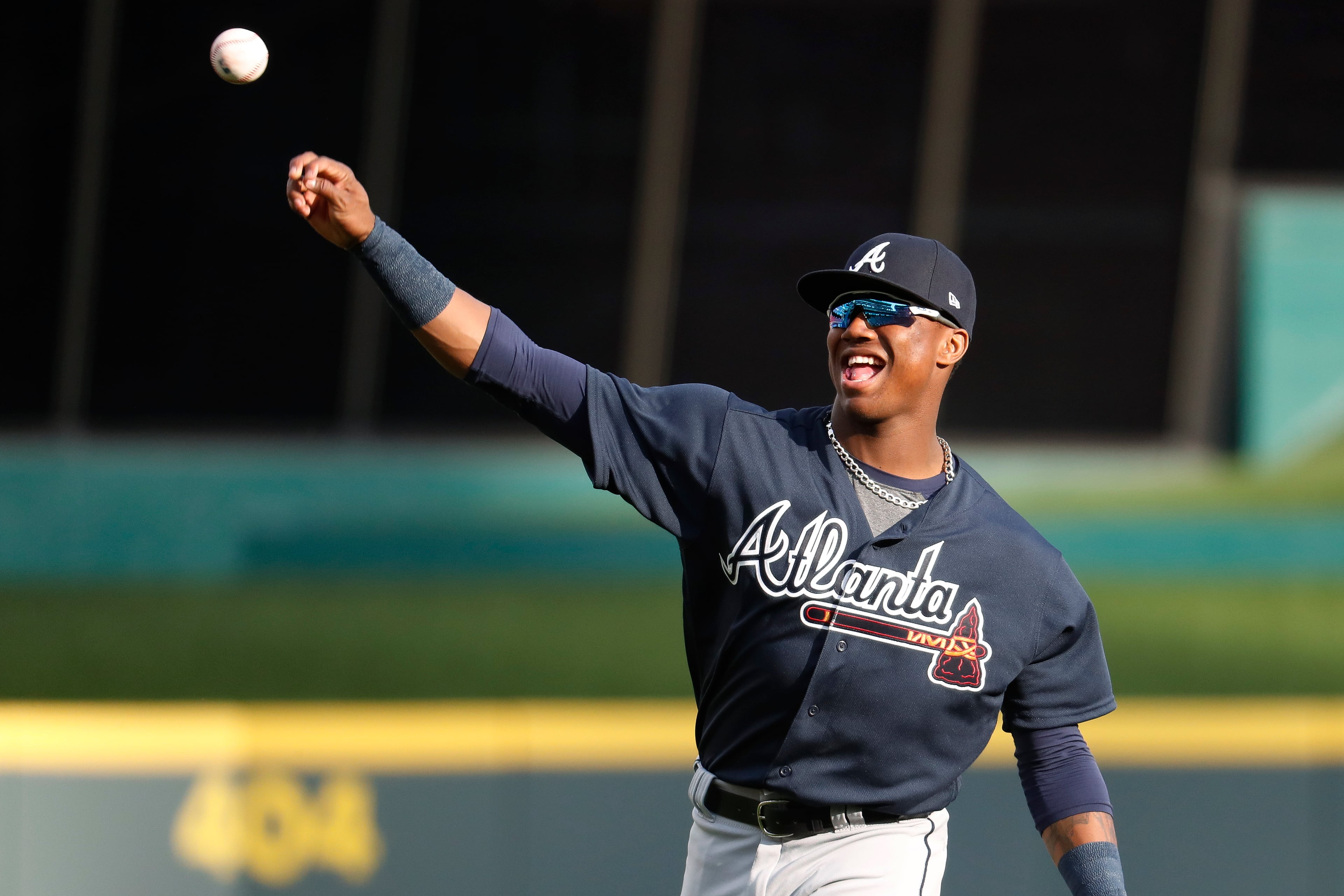 Atlanta Braves center fielder Ronald Acuna Jr. warms up for the team's baseball game against the Cincinnati Reds, Wednesday, April 25, 2018, in Cincinnati. (AP Photo/John Minchillo)