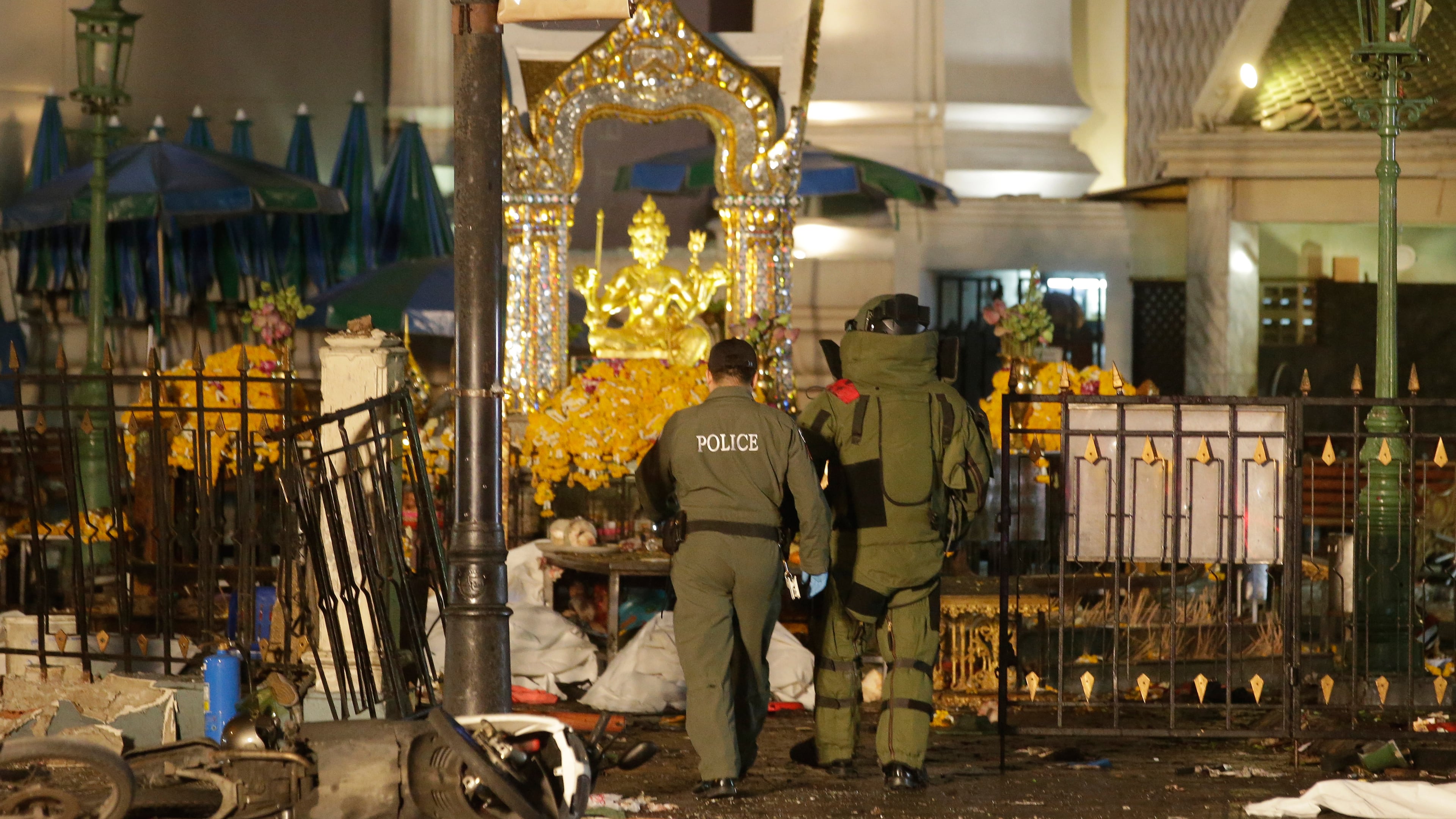 FILE - Explosive Ordnance Disposal officers enter the Erawan Shrine after an explosion in Bangkok, on Aug. 17, 2015. (AP Photo/Sackchai Lalit, File)