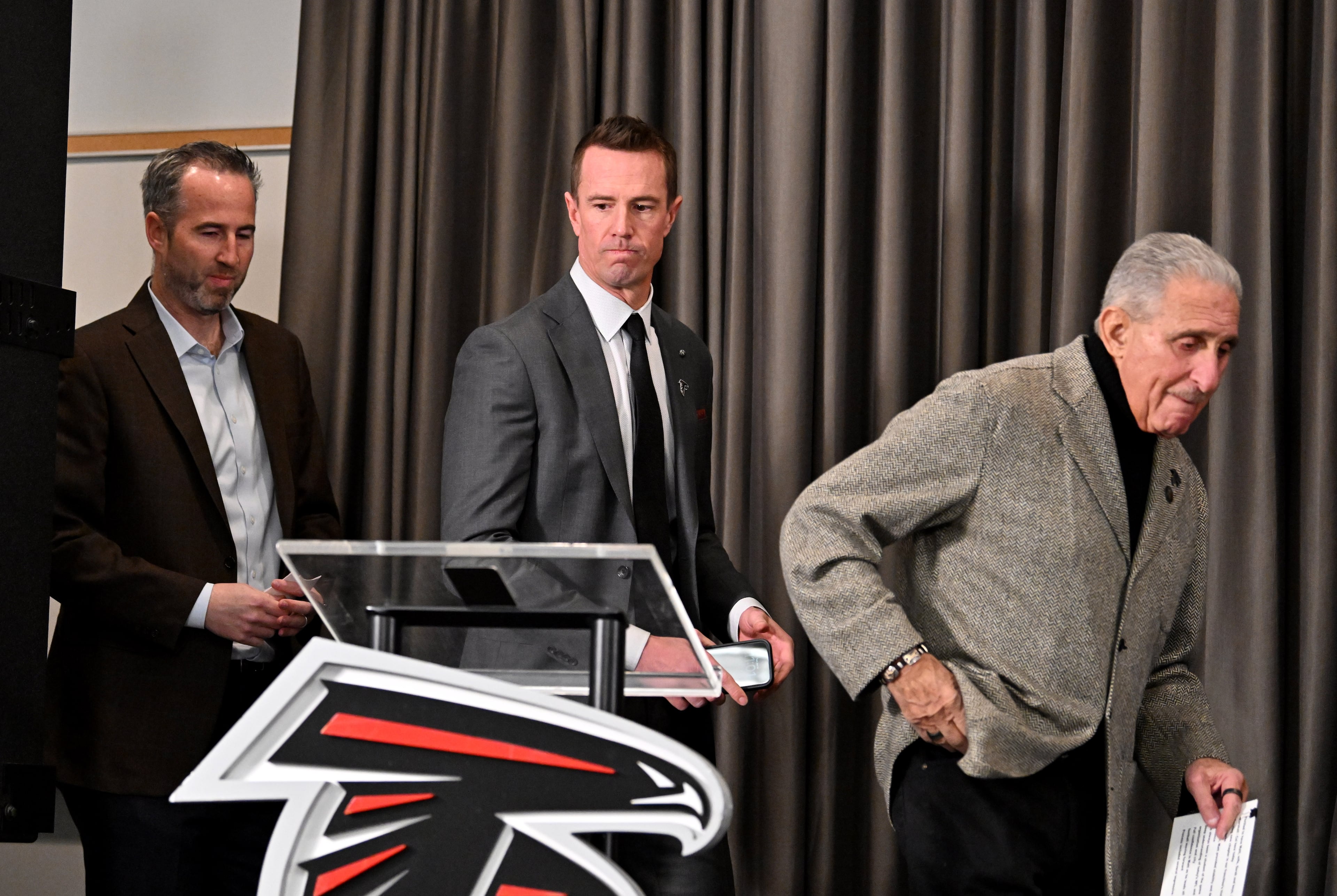 Former Atlanta Falcons quarterback Matt Ryan and Arthur M. Blank arrive for a news conference to introduce new Falcons president of football Matt Ryan, Tuesday, Jan. 13, 2026, in Flowery Branch. (Hyosub Shin/AJC)