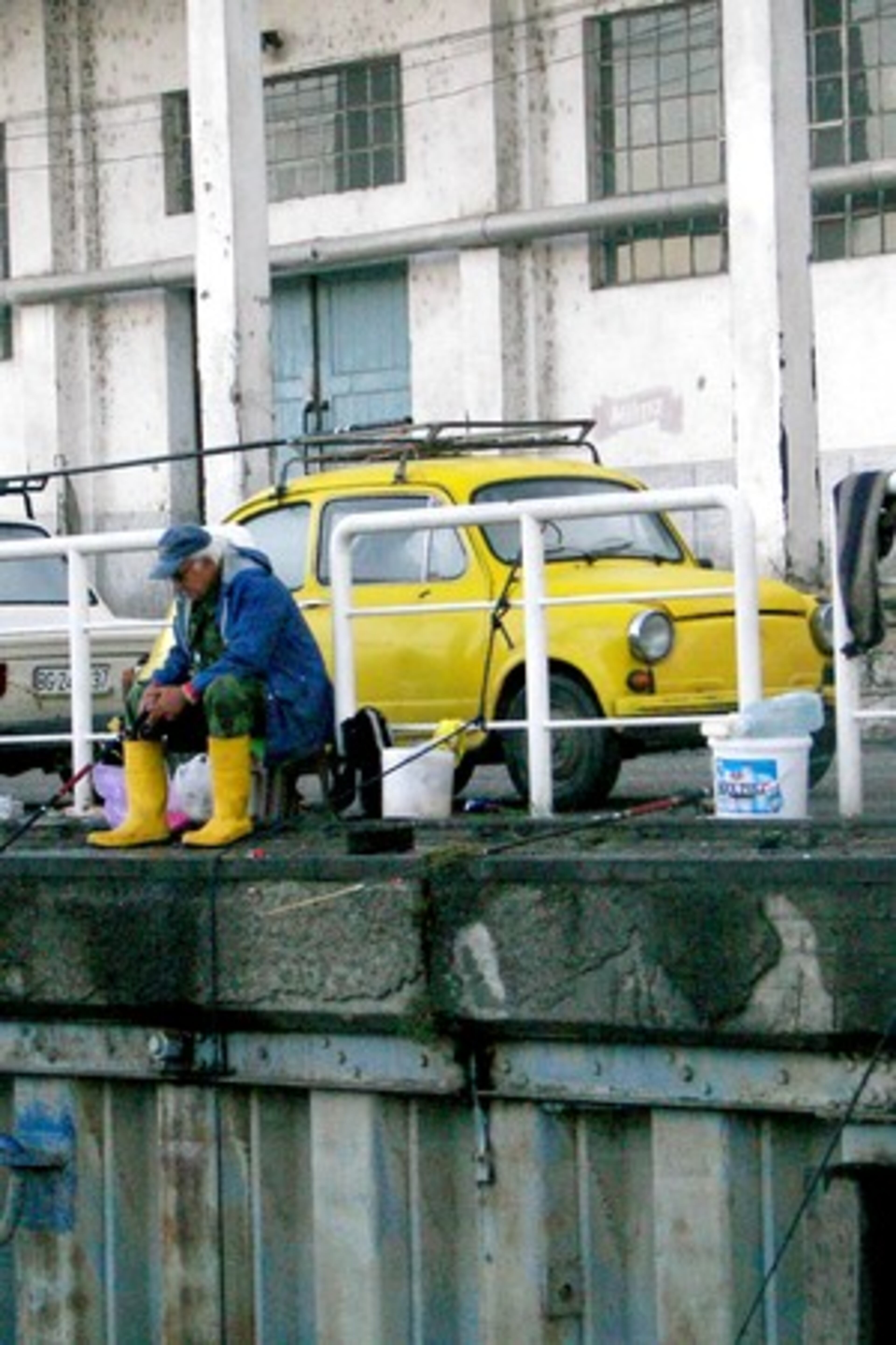 The fisherman with his yellow boots and the yellow car caught my eye. I don't know if it was his car. Belgrade, Serbia Oct, 2007