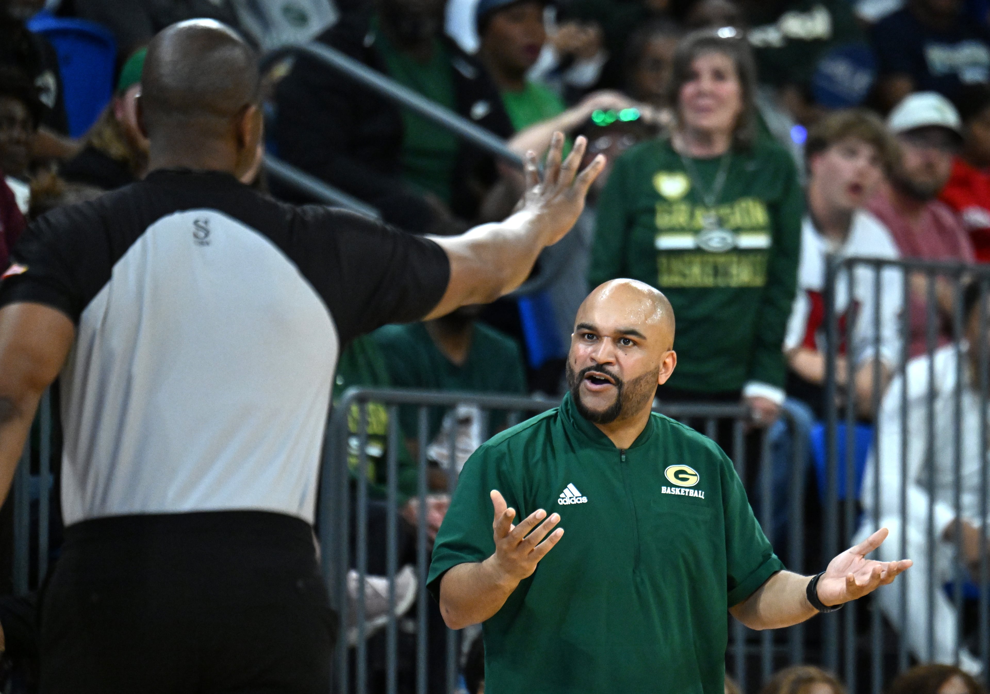 Grayson's head coach Geoffrey Pierce appeals to a referee during the second half of the GHSA Class 6A Boys State Basketball playoffs game at the Georgia State Convocation Center, Saturday, March 1, 2025, in Atlanta. Wheeler won 68-53 over Grayson. (Hyosub Shin / AJC)