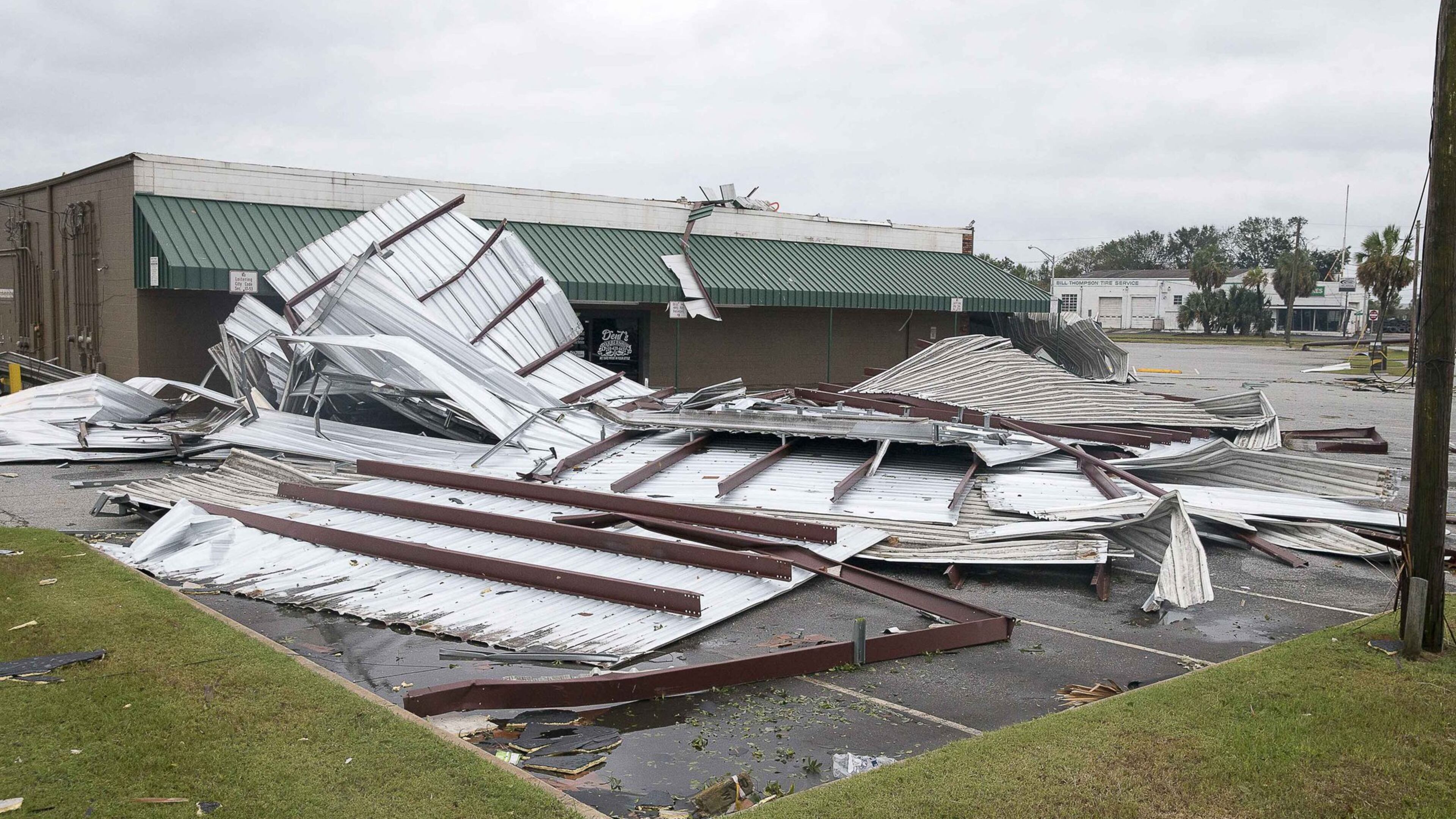 Large sheets of metal debris rests in the parking lot of the Shackleford shopping center following Hurricane Michael in Albany, Thursday, October 11, 2018. Hurricane Michael passed through Albany as a Category 2 hurricane. (ALYSSA POINTER/ALYSSA.POINTER@AJC.COM)