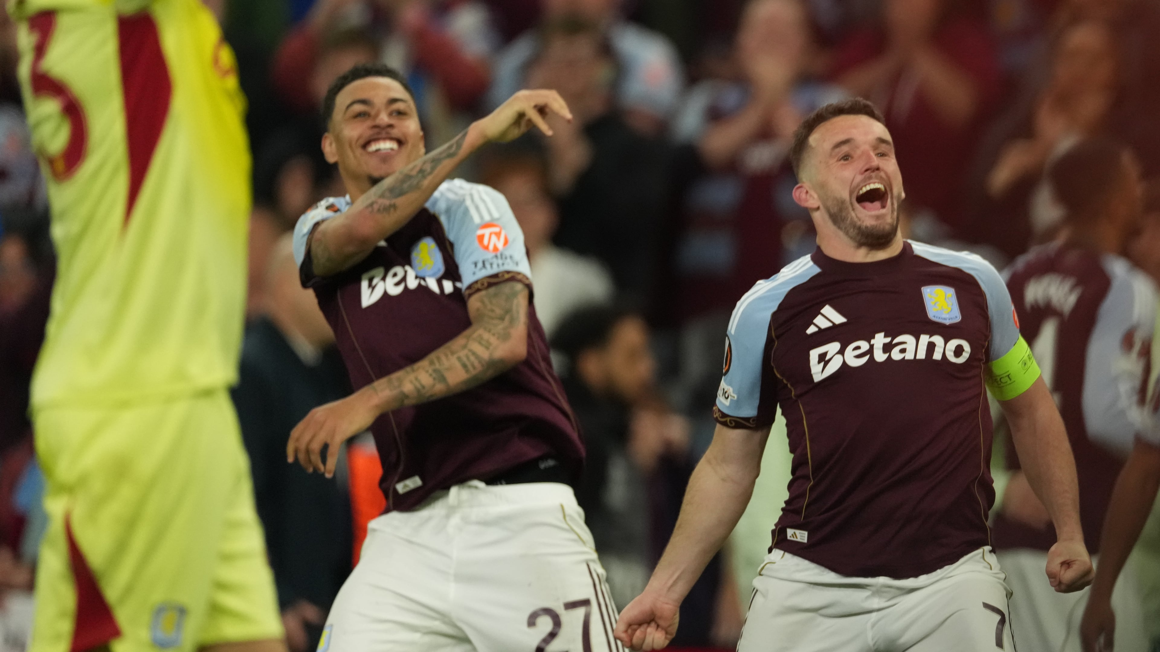 Aston Villa's John McGinn, right, and Morgan Rogers react after the Europa League second-leg semifinal soccer match between Aston Villa and Nottingham Forest in Birmingham, England, Thursday, May 7, 2026. (AP Photo/Dave Shopland)