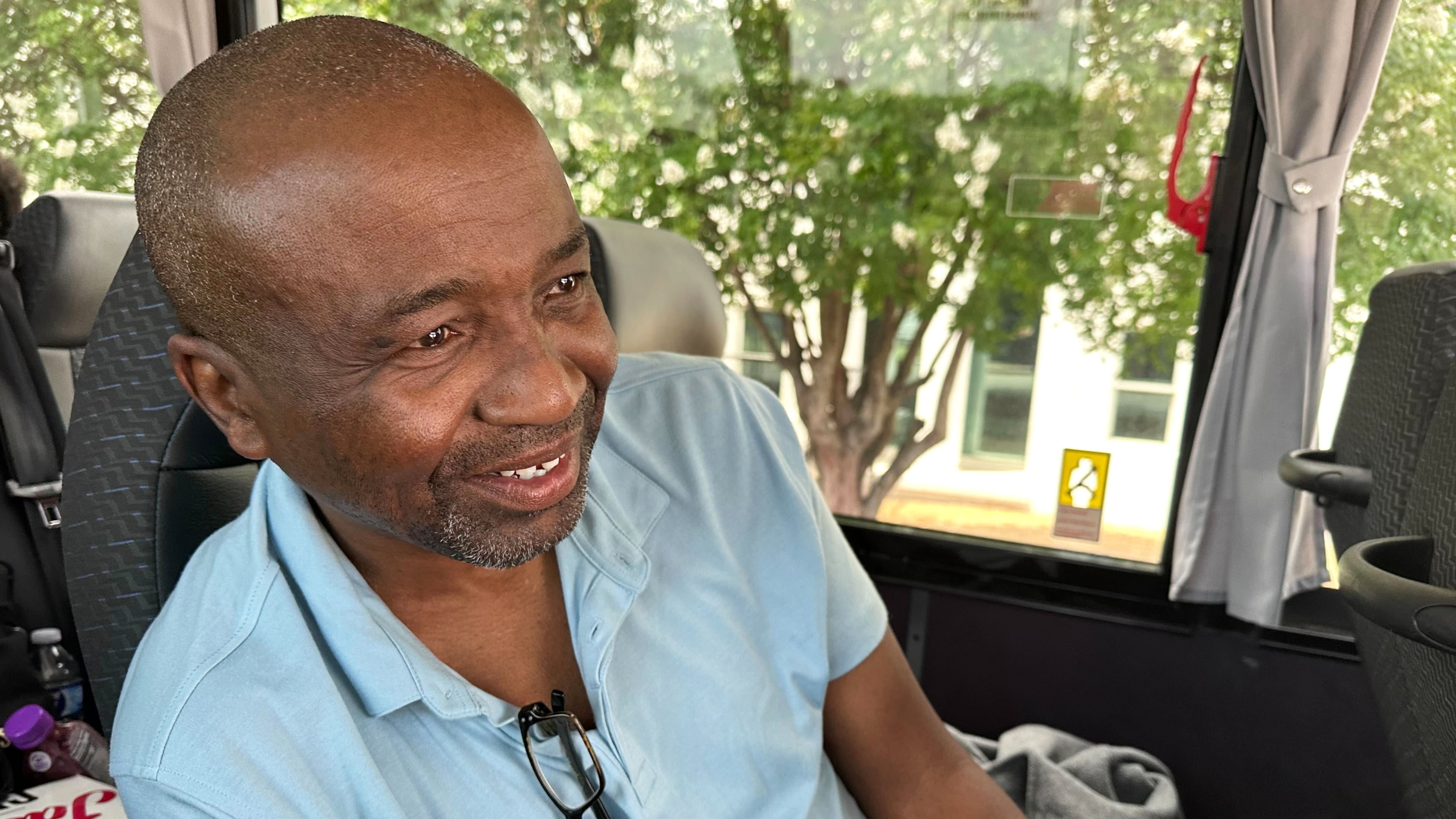 Keith Odom, a forklift driver from Aiken, S.C., looks out from his bus seat as he arrives in Montgomery, Ala., for a voting rights rally Saturday, May 16, 2026. (AP Photo/Bill Barrow)