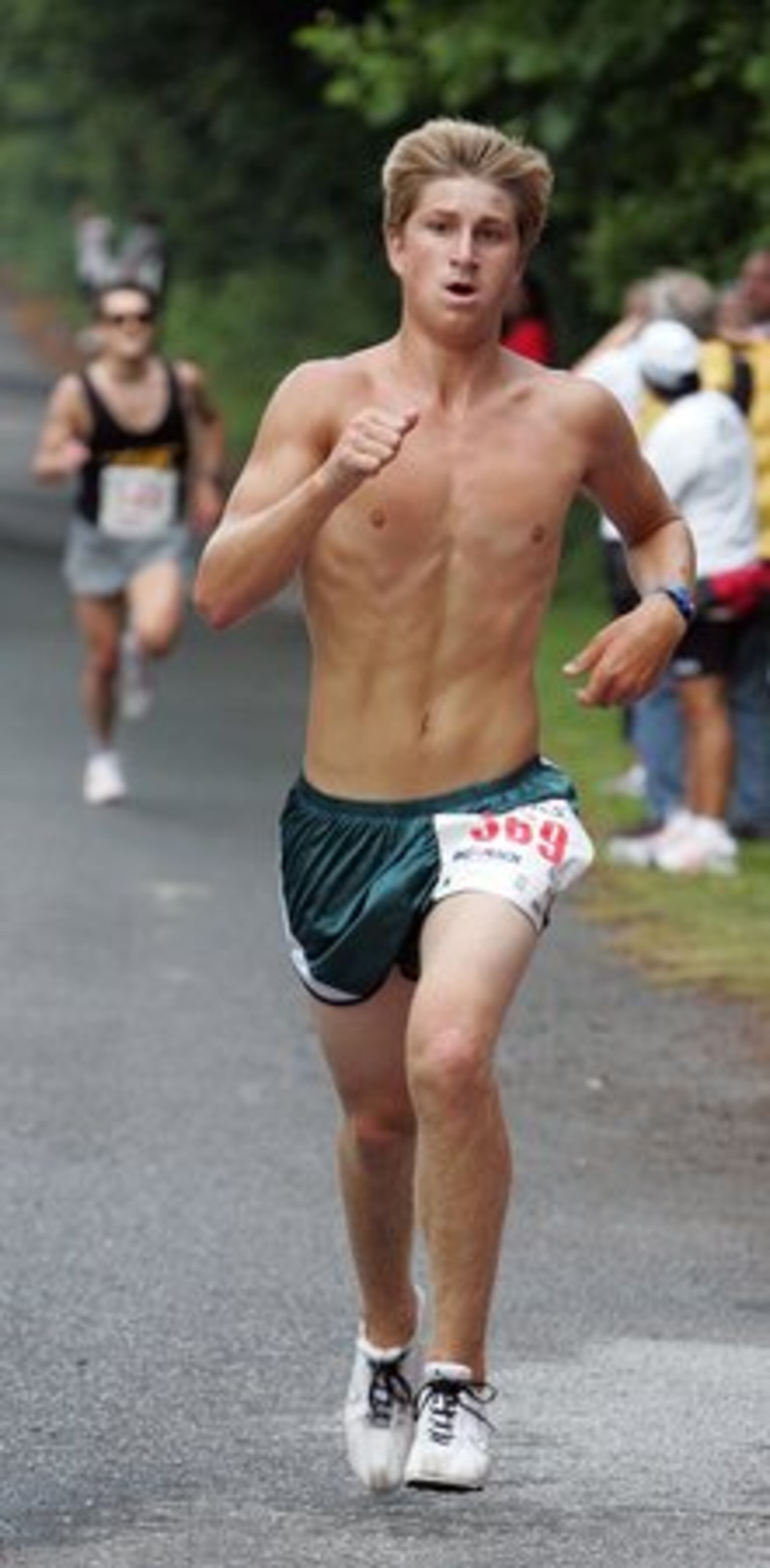 Nolan Clark (right) wins the 30th annual Possum Trot 10k Road Race followed by Nicholas Sterghos.