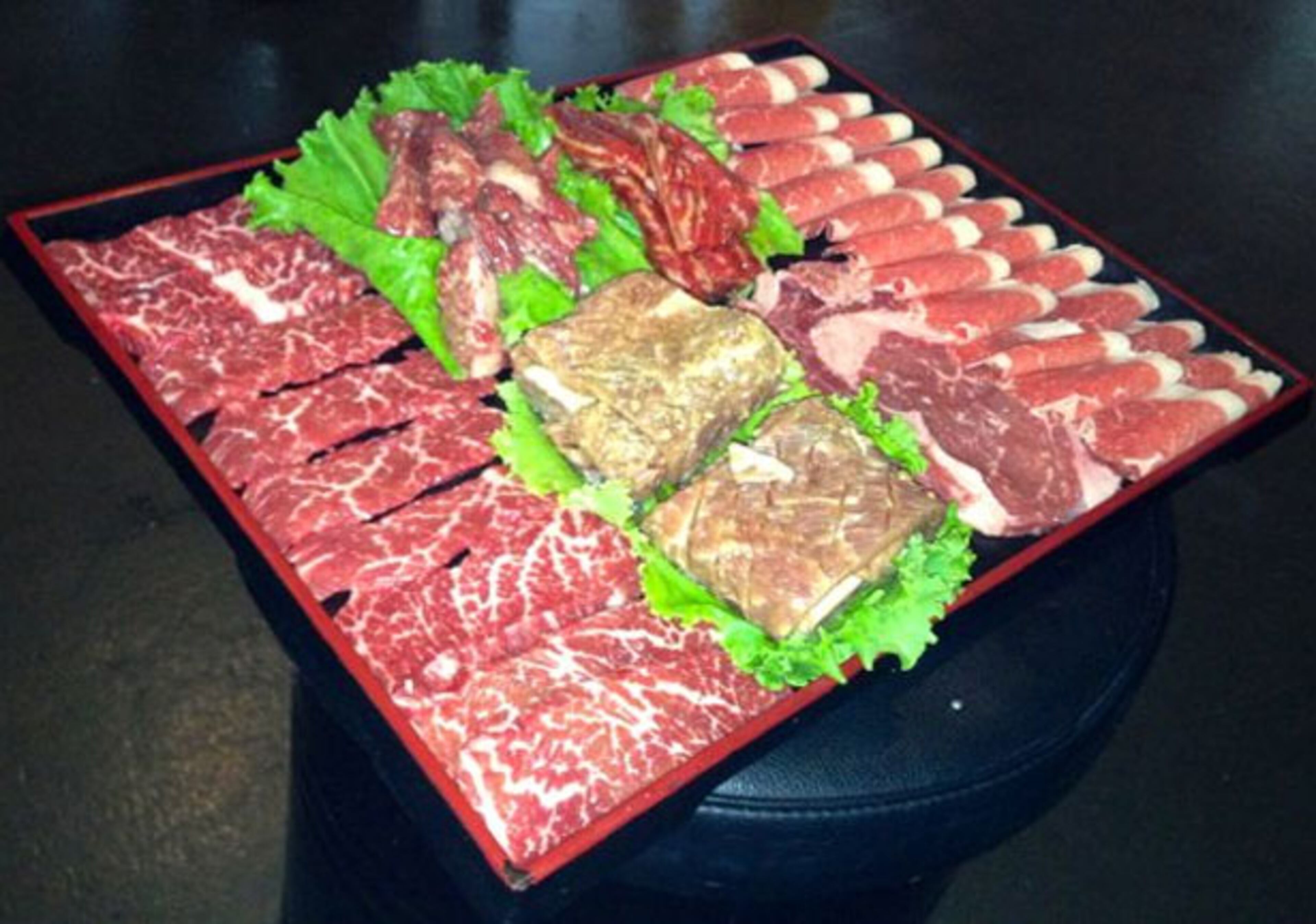 "Our family of five decided to go for the full-on beef experience rather than ordering à la carte. It costs $99 and supposedly feeds three-four people, but we found it ample. The meal includes not only wraps, sauces, dips and banchan, but also soup, rice and a big bowl of noodle soup to finish the meal out. So…20 bucks a head. Not bad!"