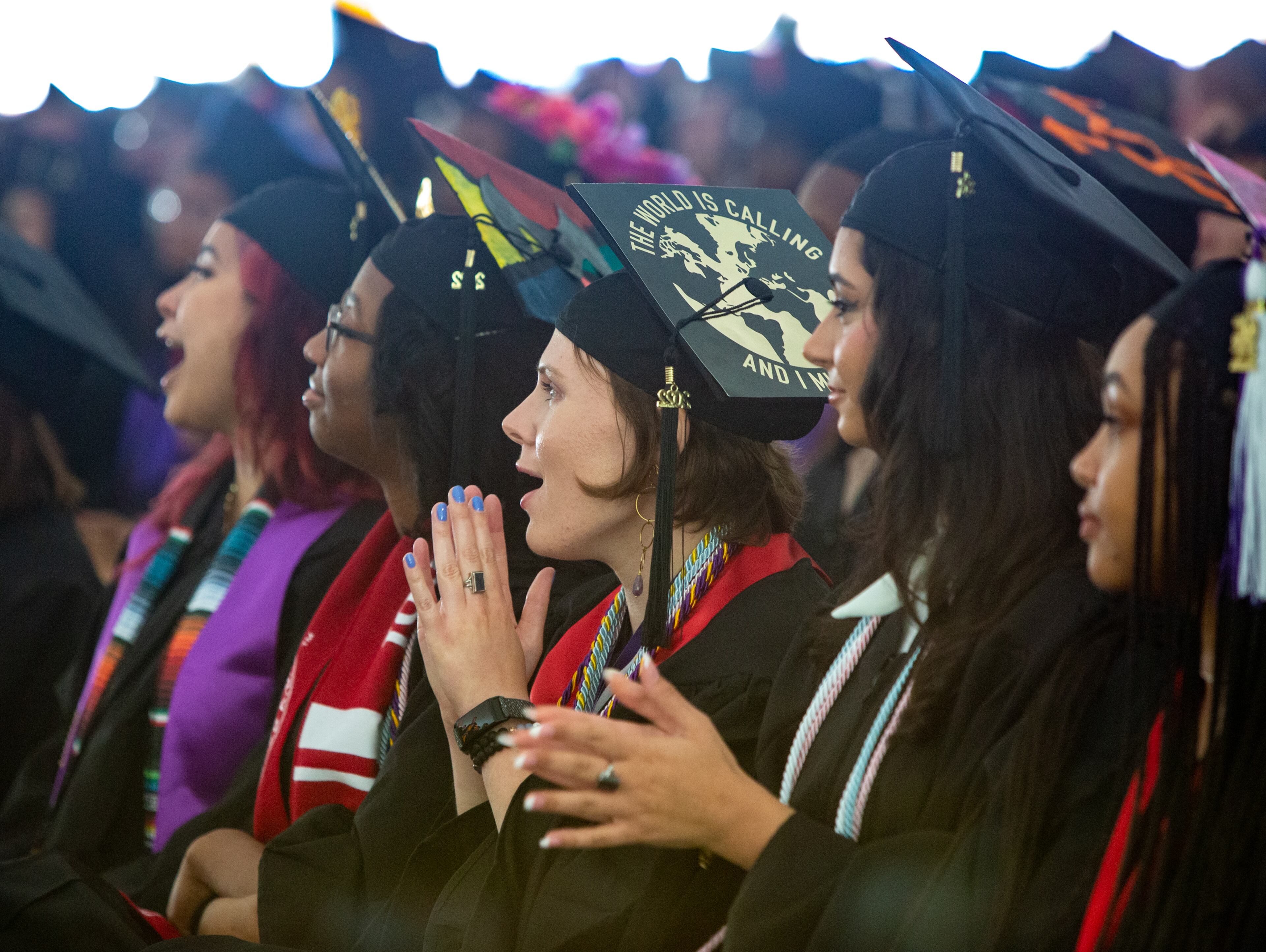 Margaret Andres celebrates with her classmates during the Agnes Scott College graduation ceremony on Saturday, May 14, 2022. Andres will continue her education and is planning to get a master’s degree in archeology. (Jenni Girtman for The Atlanta Journal-Constitution)