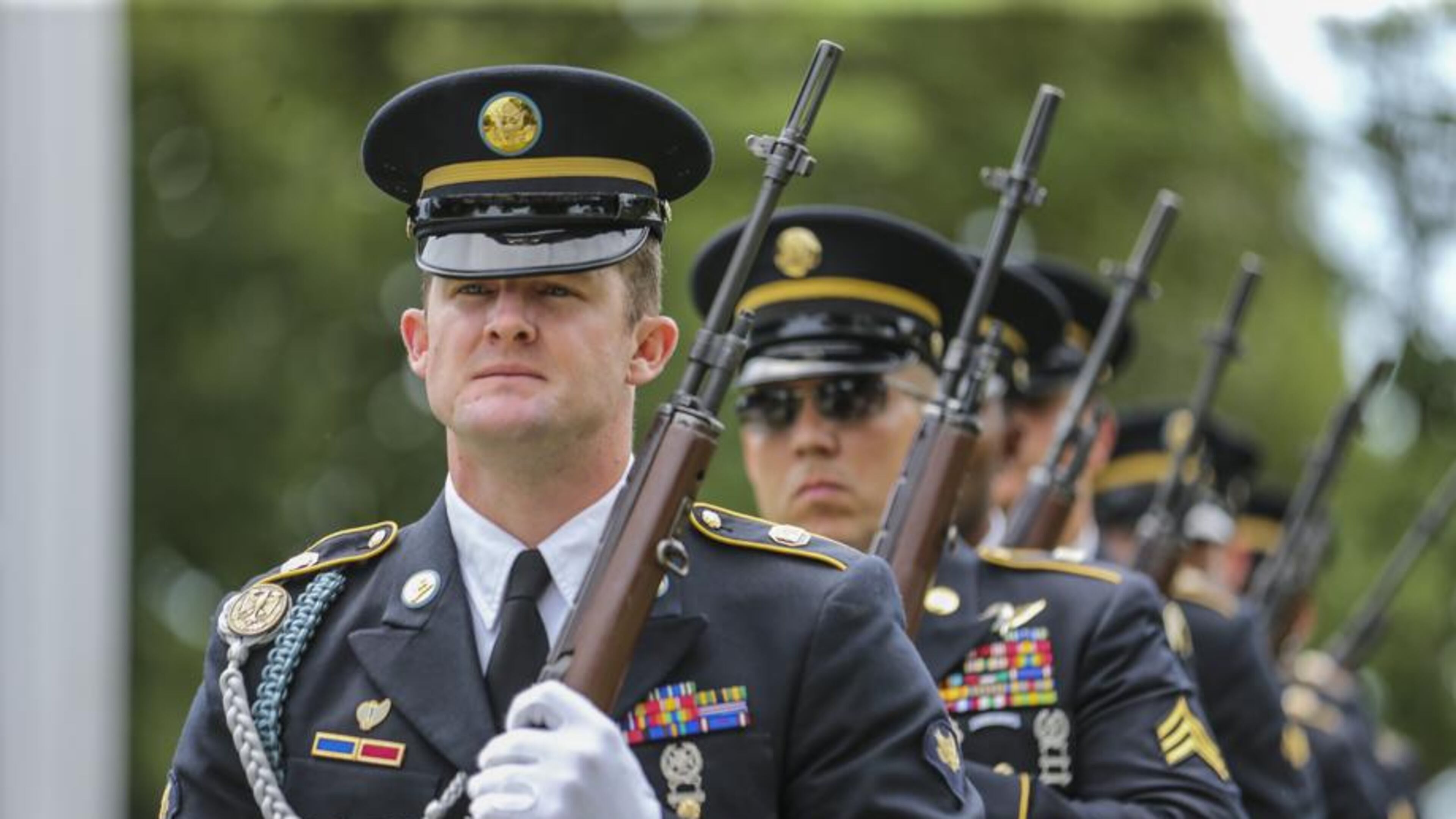 Georgia Army National Guard Honor Guard Specialist Ronnie Reddish stands at attention during the Memorial Day ceremony at the Marietta National Cemetery on Monday, May 29, 2017. JOHN SPINK/JSPINK@AJC.COM.