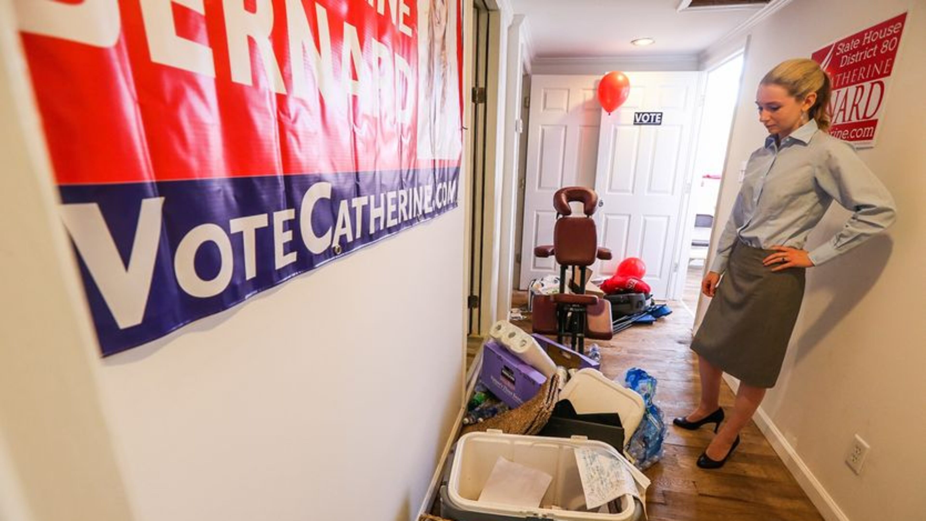 Georgia House of Representatives District 80 candidate Catherine Bernard surveys the damage at her campaign headquarters on Mon day. John Spink, jspink@ajc.com