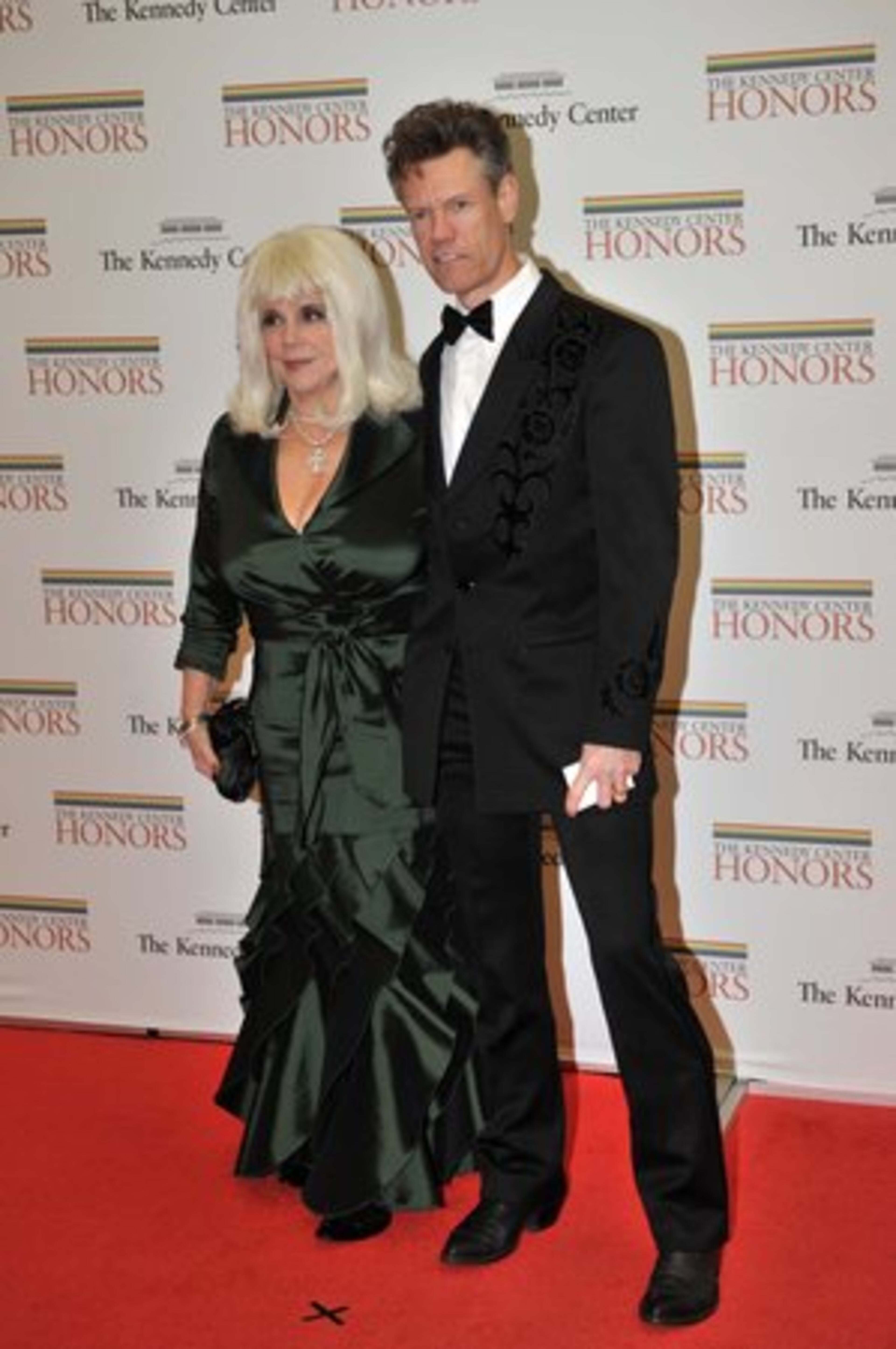 Country singer Randy Travis and his wife arrive for the dinner. He was among those who performed George Jones' songs.