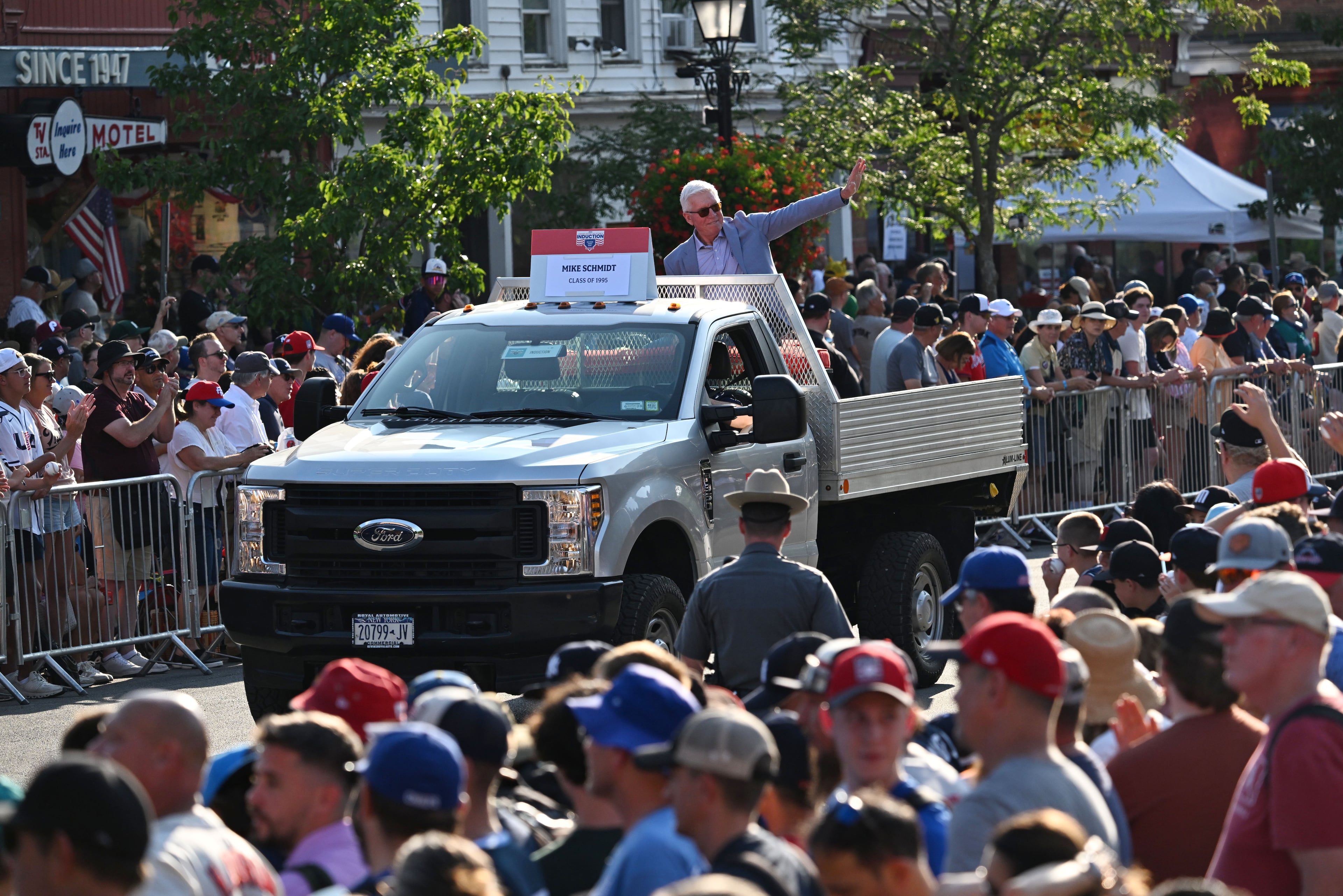 National Baseball Hall of Fame member Mike Schmidt waves to spectators from the back of a pickup truck during the Hall of Fame Legends Parade on Saturday, July 25, 2026, in Cooperstown, N.Y. (Hyosub Shin/AJC)