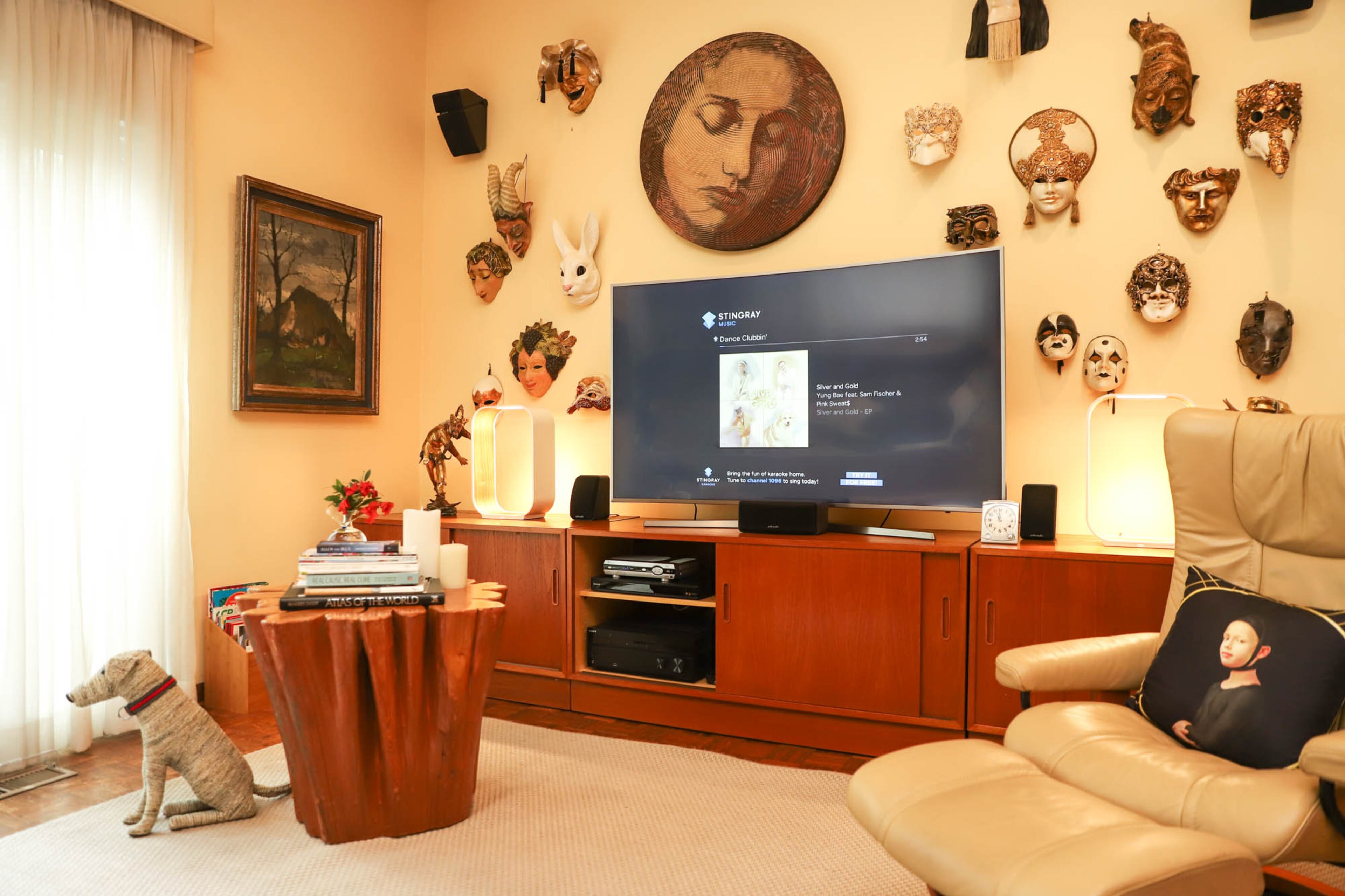 The den of Han Frabel and David Copeland’s home is the area of their home where they relax. A gallery wall of masks and busts surrounds their TV. Frabel developed an affection for ornate masks in his youth in Germany, where there are large Carnival celebrations. Many of the masks on the wall are from Europe, and several are from a single shop in Florence that the couple stumbled upon during a trip to Italy. Text by Shannon Dominy/Photo by Reynolds Rogers