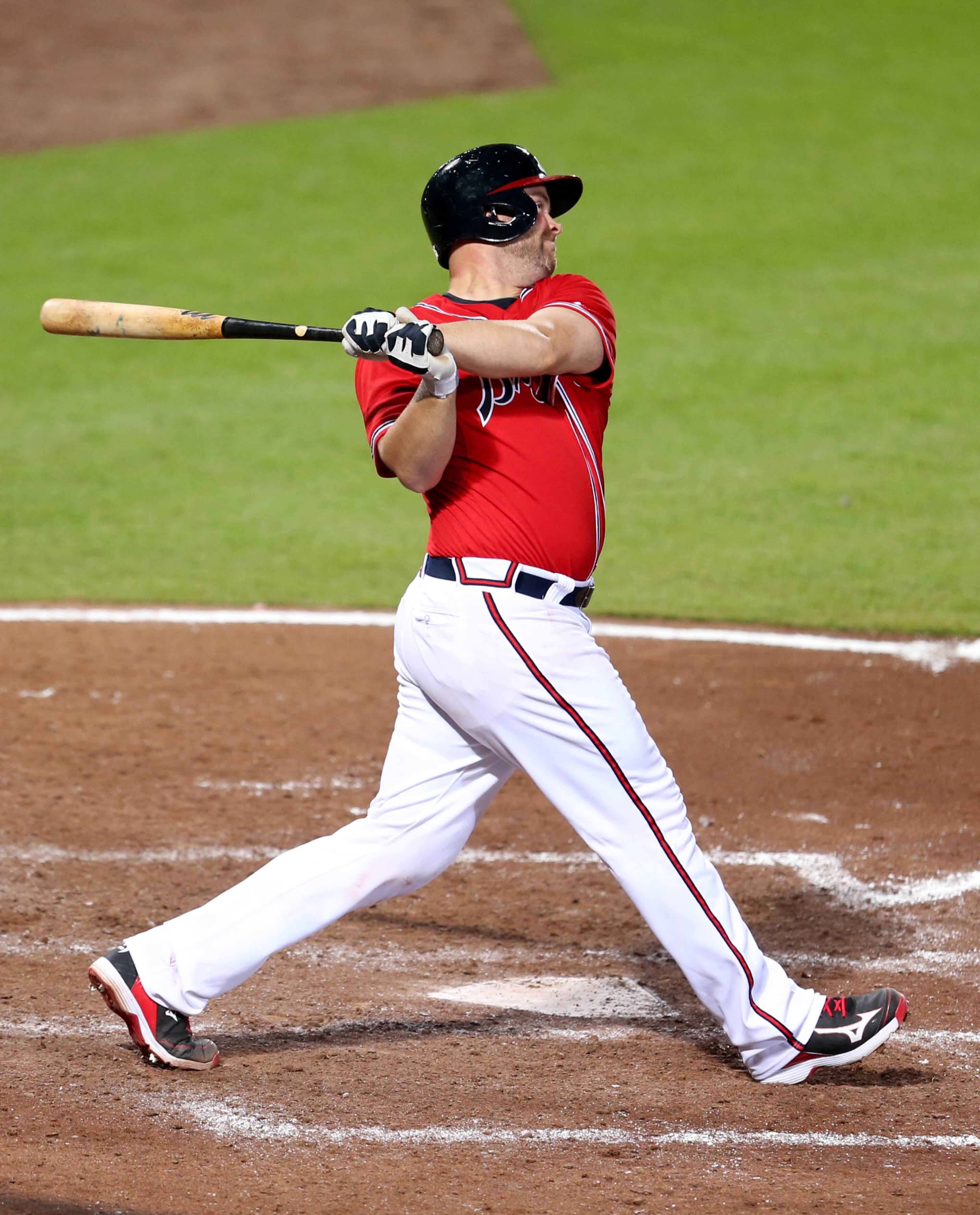 Braves catcher Brian McCann hits a solo home run in the 7th inning of their game against the Cincinnati Reds at Turner Field Friday night in Atlanta, Ga., July 12, 2013. The Reds defeated the Braves 4-2. This is the second of a four game series versus the Cincinnati Reds. JASON GETZ / JGETZ@AJC.COM