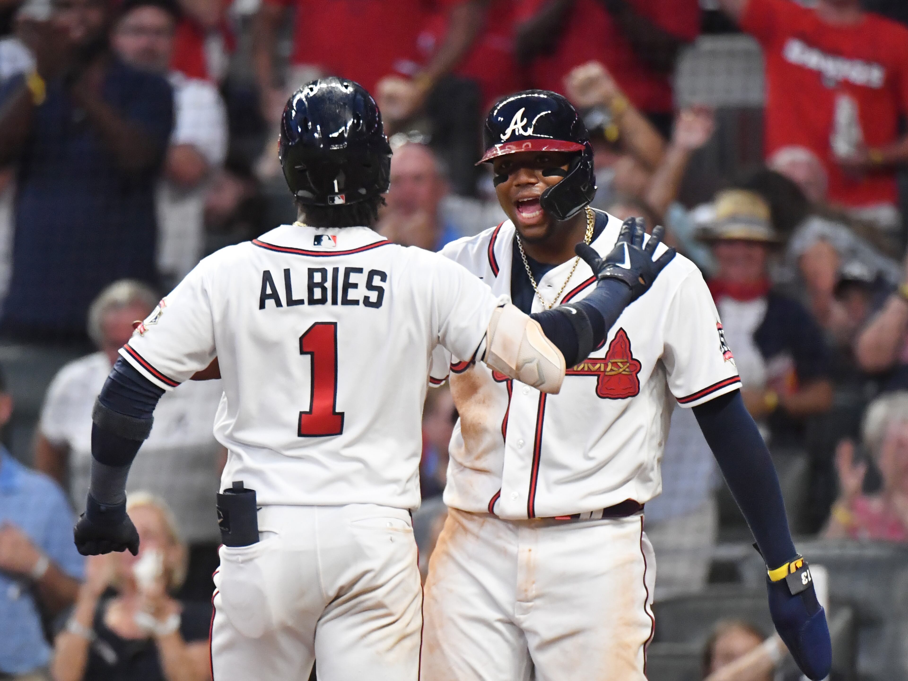 June 29, 2021 Atlanta - Atlanta Braves second baseman Ozzie Albies (1) celebrates with Atlanta Braves right fielder Ronald Acuna Jr. (13) after hitting three run home run in the 5th inning at Truist Park on Tuesday, June 29, 2021. New York Mets won 4-3 over Atlanta Braves. (Hyosub Shin / Hyosub.Shin@ajc.com)