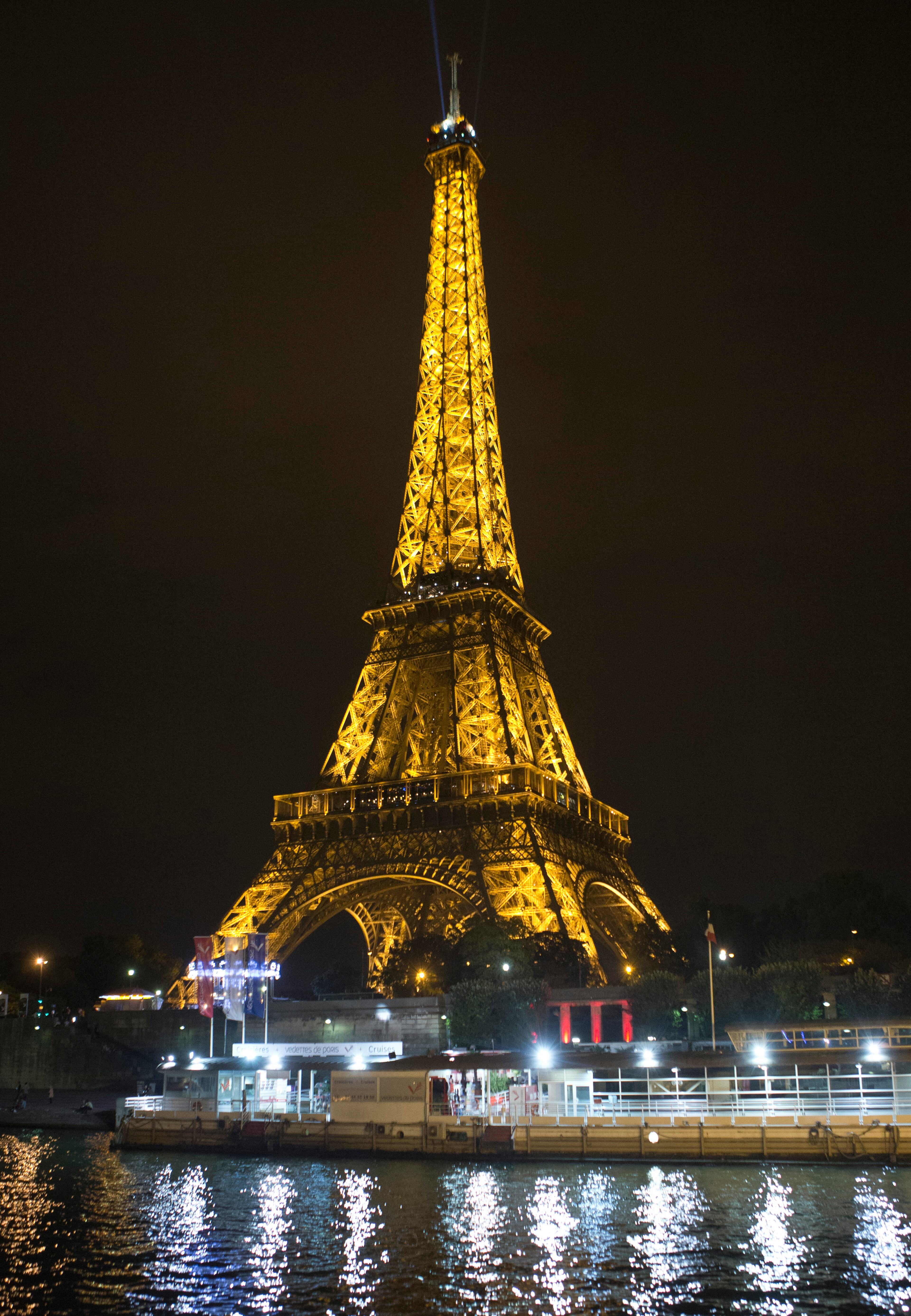 The Eiffel Tower is pictured from the Seine river in Paris, Wednesday night, Sept. 17, 2014. (AP Photo/Jacques Brinon)