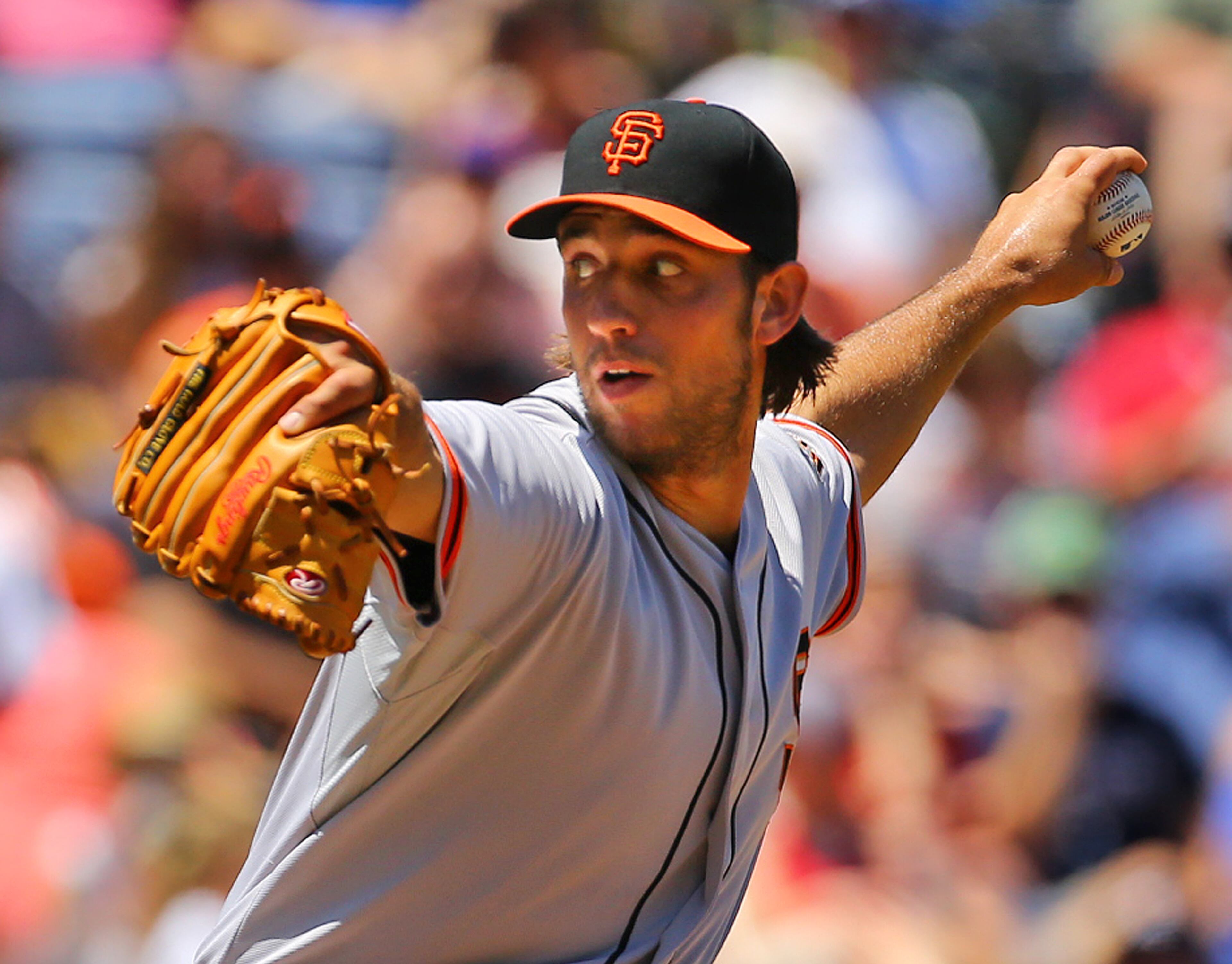 Giants pitcher Madison Bumgarner delivers a pitch against the Braves during the fourth inning of a MLB baseball game on Sunday, May 4, 2014, in Atlanta. CURTIS COMPTON / CCOMPTON@AJC.COM