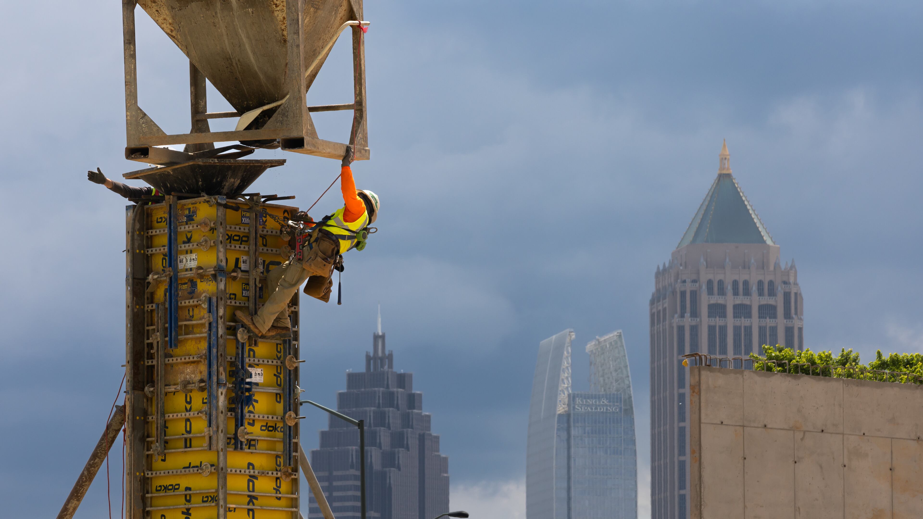 Workers prepare forms May 15 near 17th Street in West Midtown Atlanta, where Southeastern Development Brokerage Consulting is developing a mixed-use project called UrbA ATL, which will have 321 luxury apartments and about 27,000 square feet of retail and restaurants. (John Spink/The Atlanta Journal-Constitution)